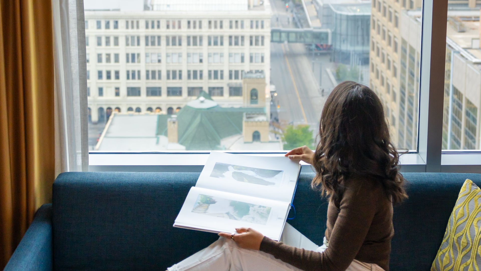 3 of 4 Hyatt Regency Calgary Guestroom City View Woman Sitting