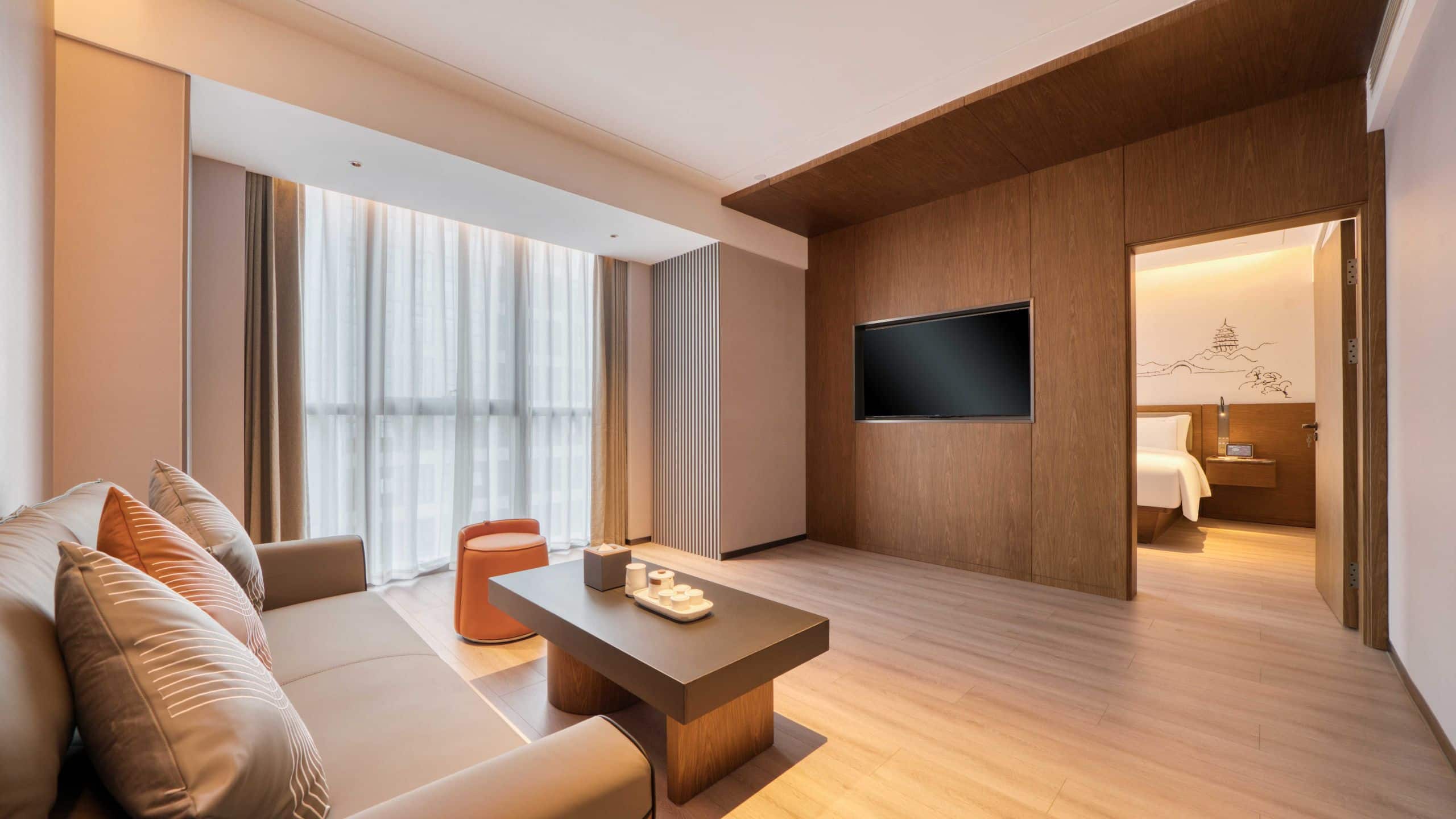 4 of 8 UrCove Hangzhou North Grand Canal Executive Grand King Seating Area Television