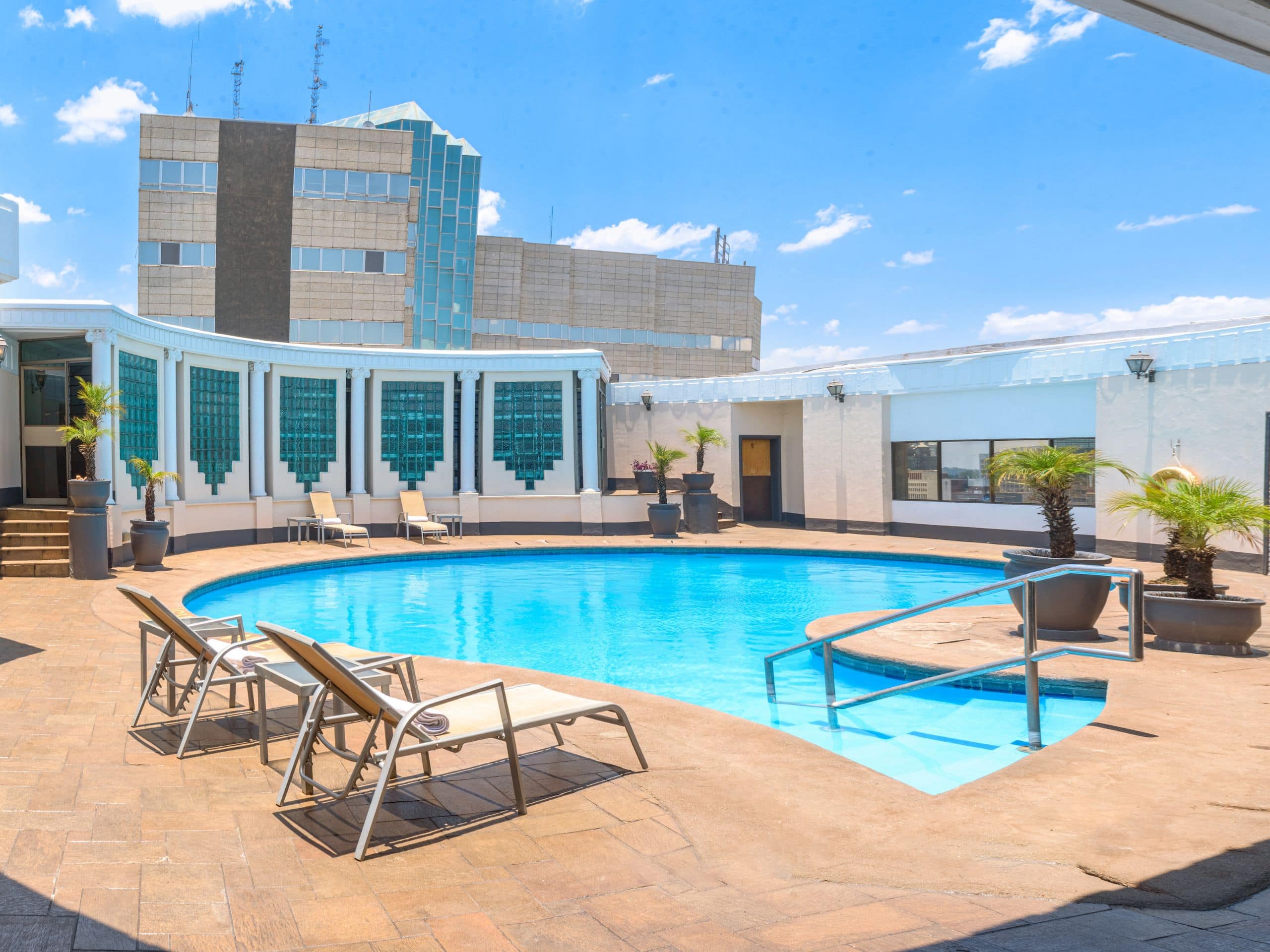 The luxurious Hyatt Regency Harare The Meikles hotel in Harare features a magnificent swimming pool right in the heart of the building.