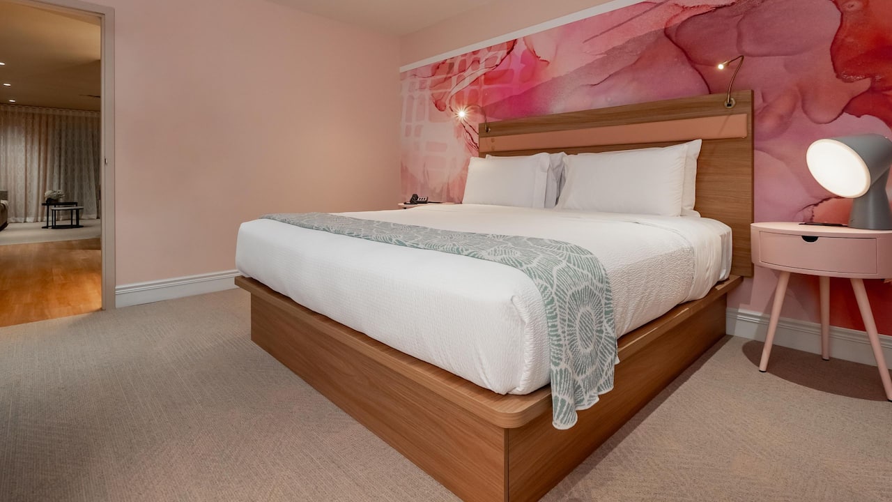 King Bed Guestroom With Bedside Table