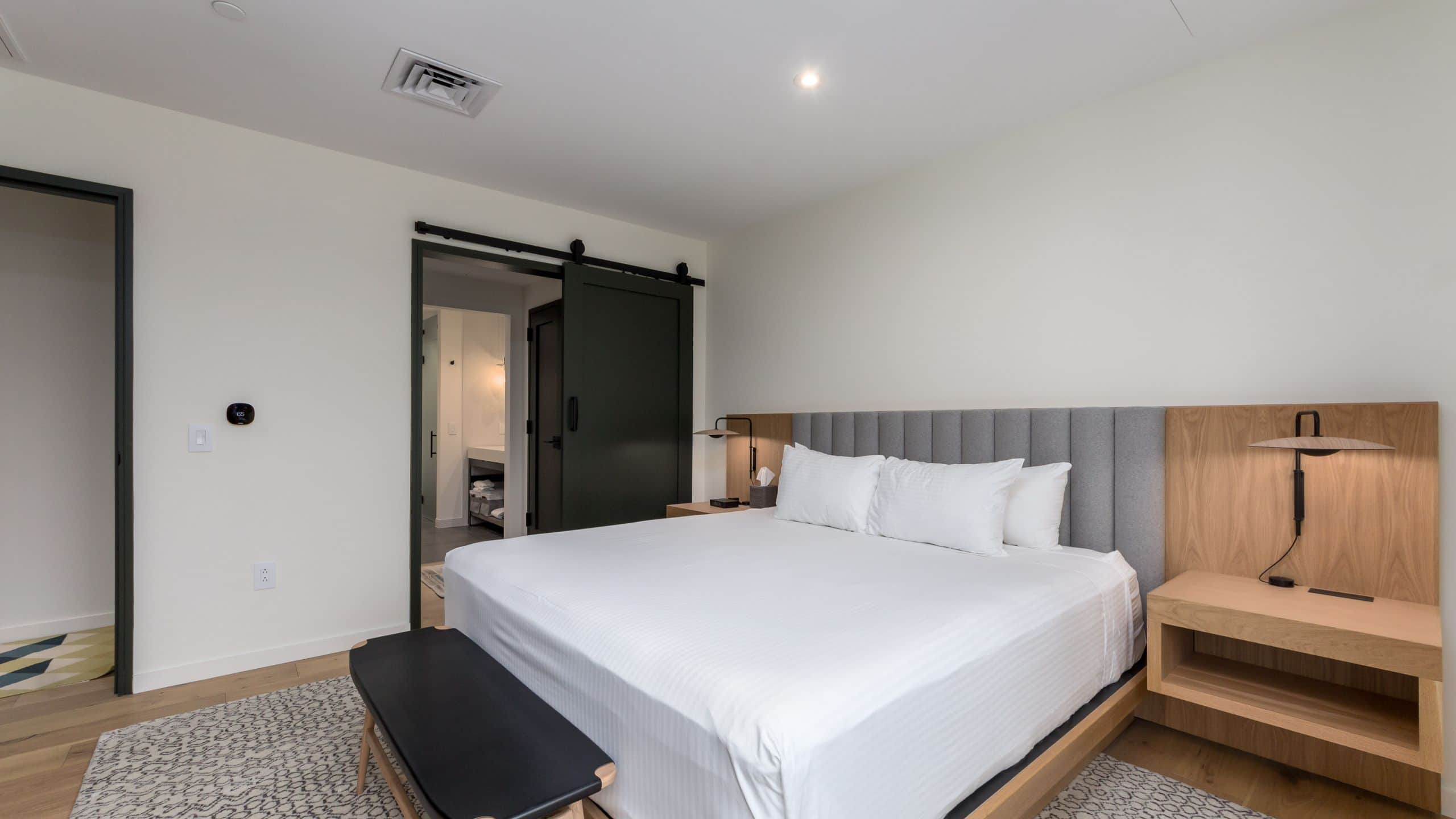 2 of 5 The Lodge at Spruce Peak Three Bed Treehouse Bed View