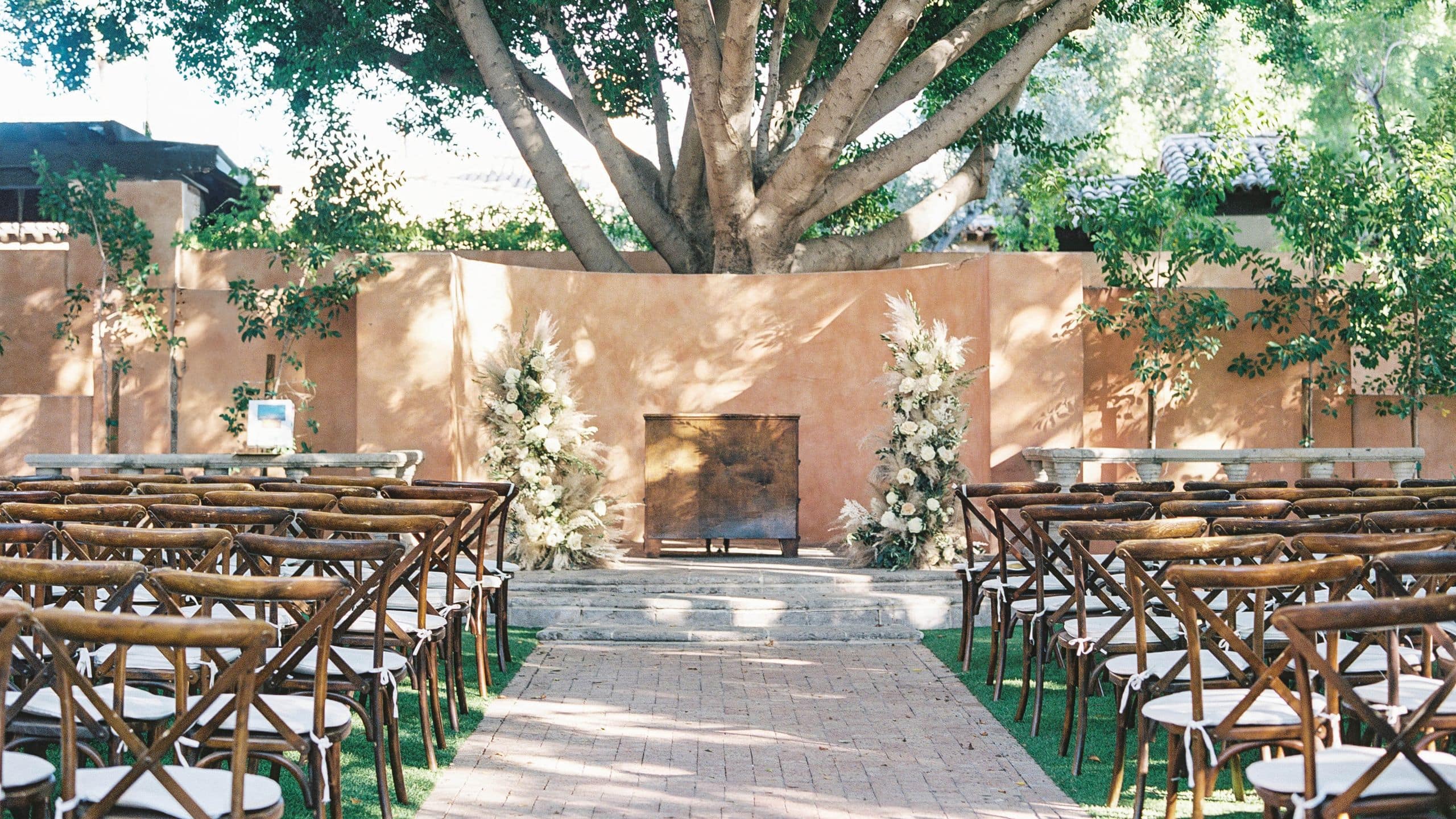 2 of 9 Royal Palms Resort and Spa Alegria Garden Wedding Ceremony With Brown Chairs