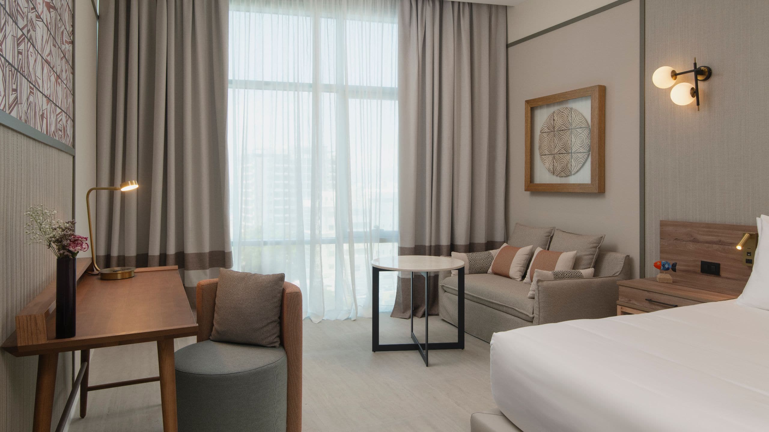 1 of 1 Hyatt Centric Santo Domingo Guestroom Seating Area With Curtain Sheers