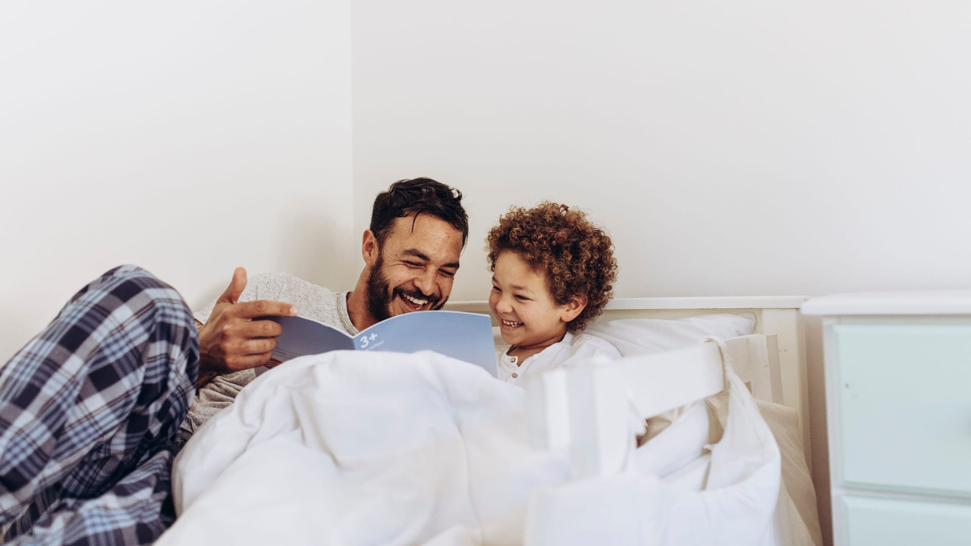 Hyatt Hotels Stock Father Son Bed Reading