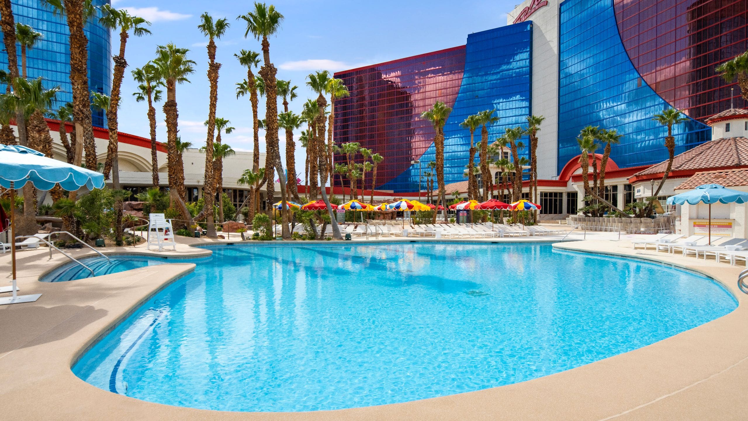 1 of 1 Rio Hotel and Casino Swimming Pool With Loungers and Umbrellas