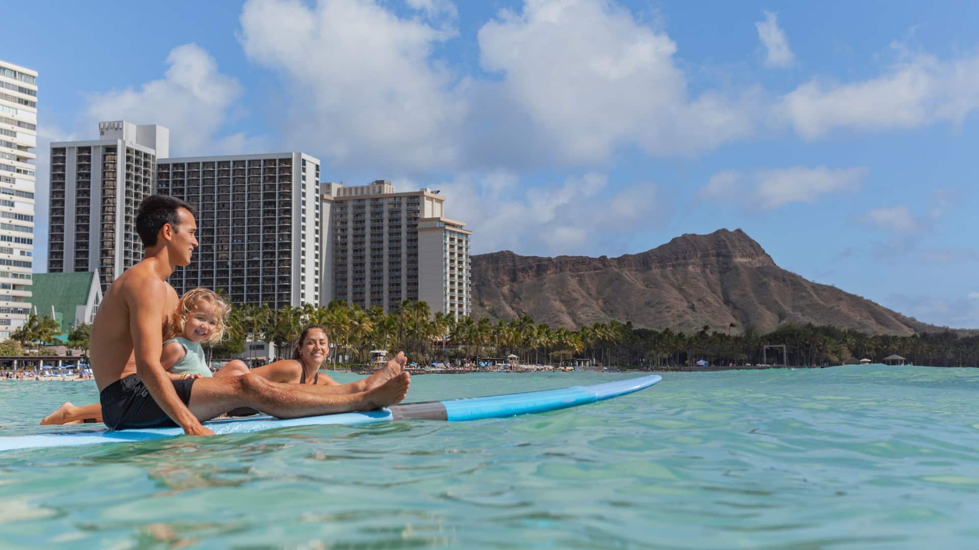 Hyatt Regency Waikiki Beach Resort and Spa Lifestyle Family Surfing And Sitting With Diamond Head