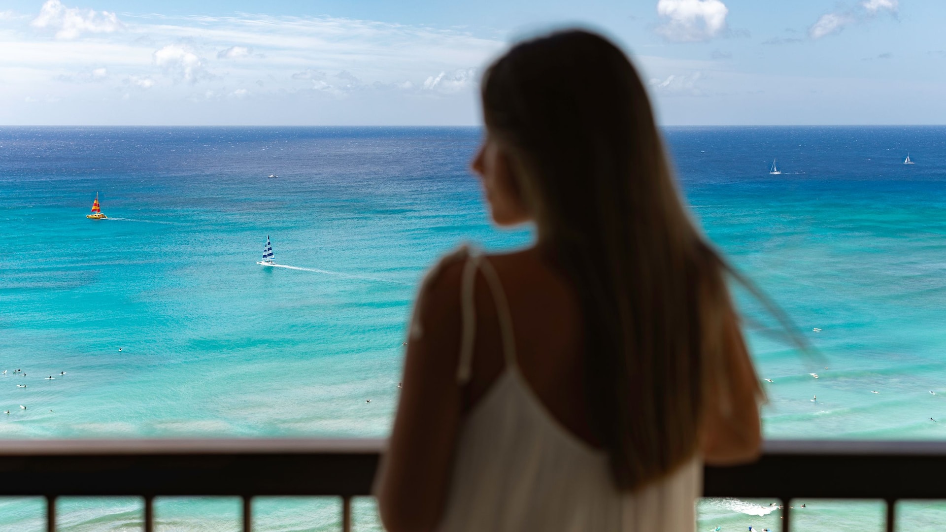 Hyatt Regency Waikiki Beach Resort and Spa Female Staring Out To Waikiki Facing Left On