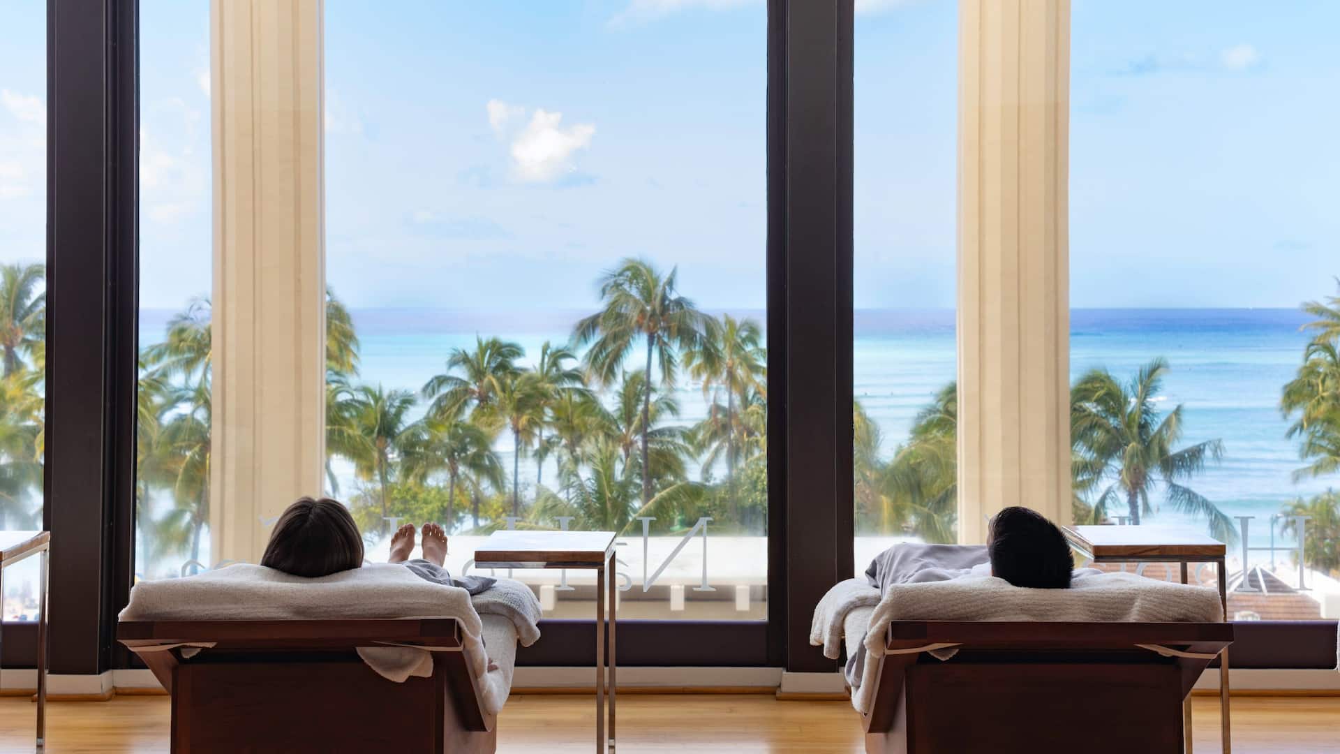 Hyatt Regency Waikiki Beach Resort and Spa Couple Lounging Overlooking Waikiki In Spa Waiting Room