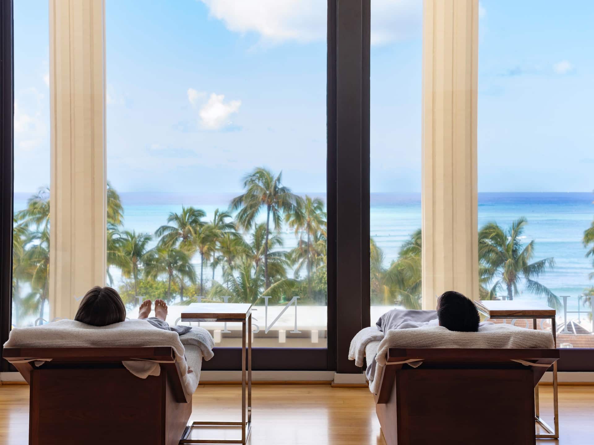 Hyatt Regency Waikiki Beach Resort and Spa Couple Lounging Overlooking Waikiki In Spa Waiting Room