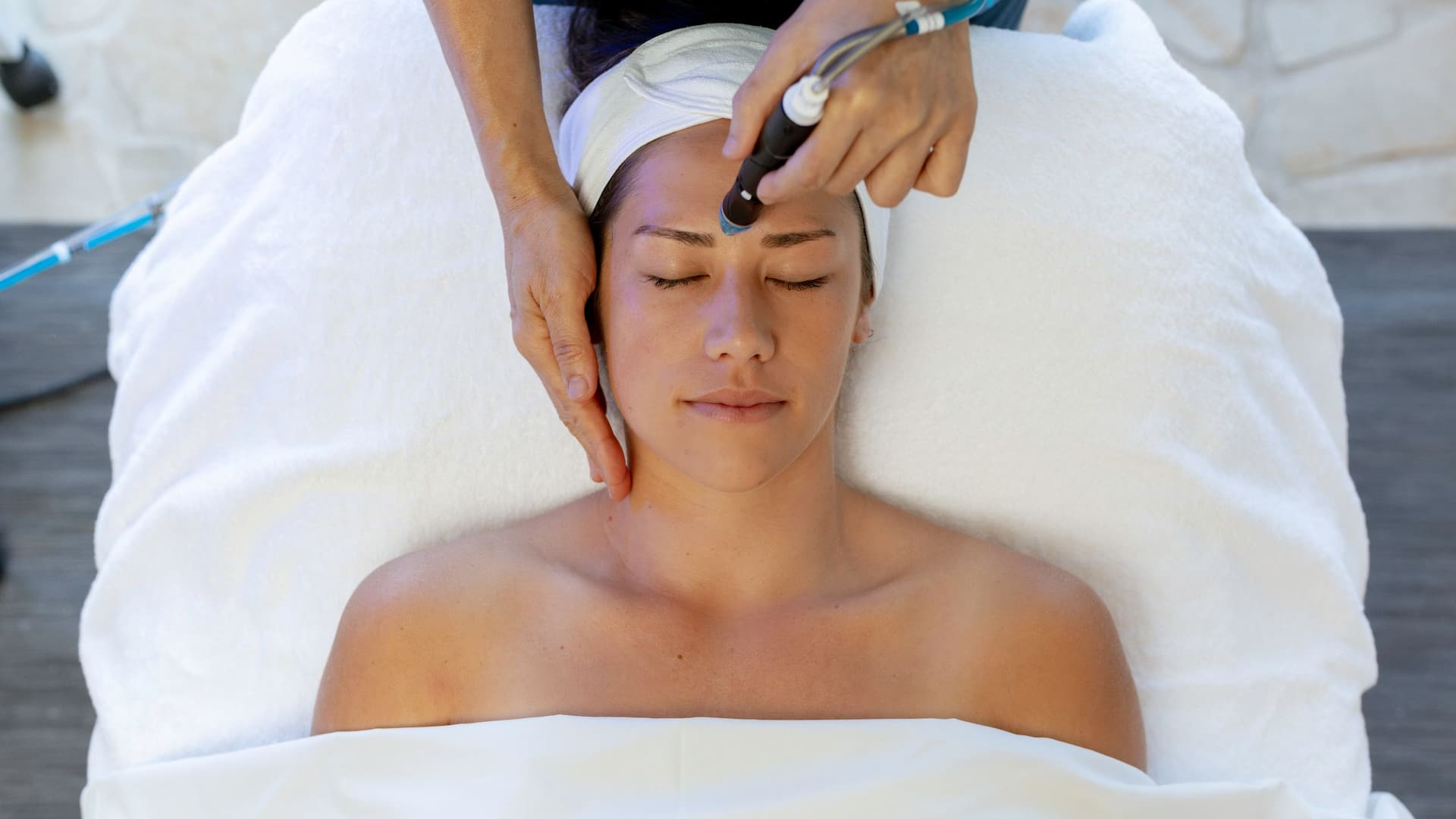 Hyatt Regency Waikiki Beach Resort and Spa Female Enjoying Hydrafacial Treatment