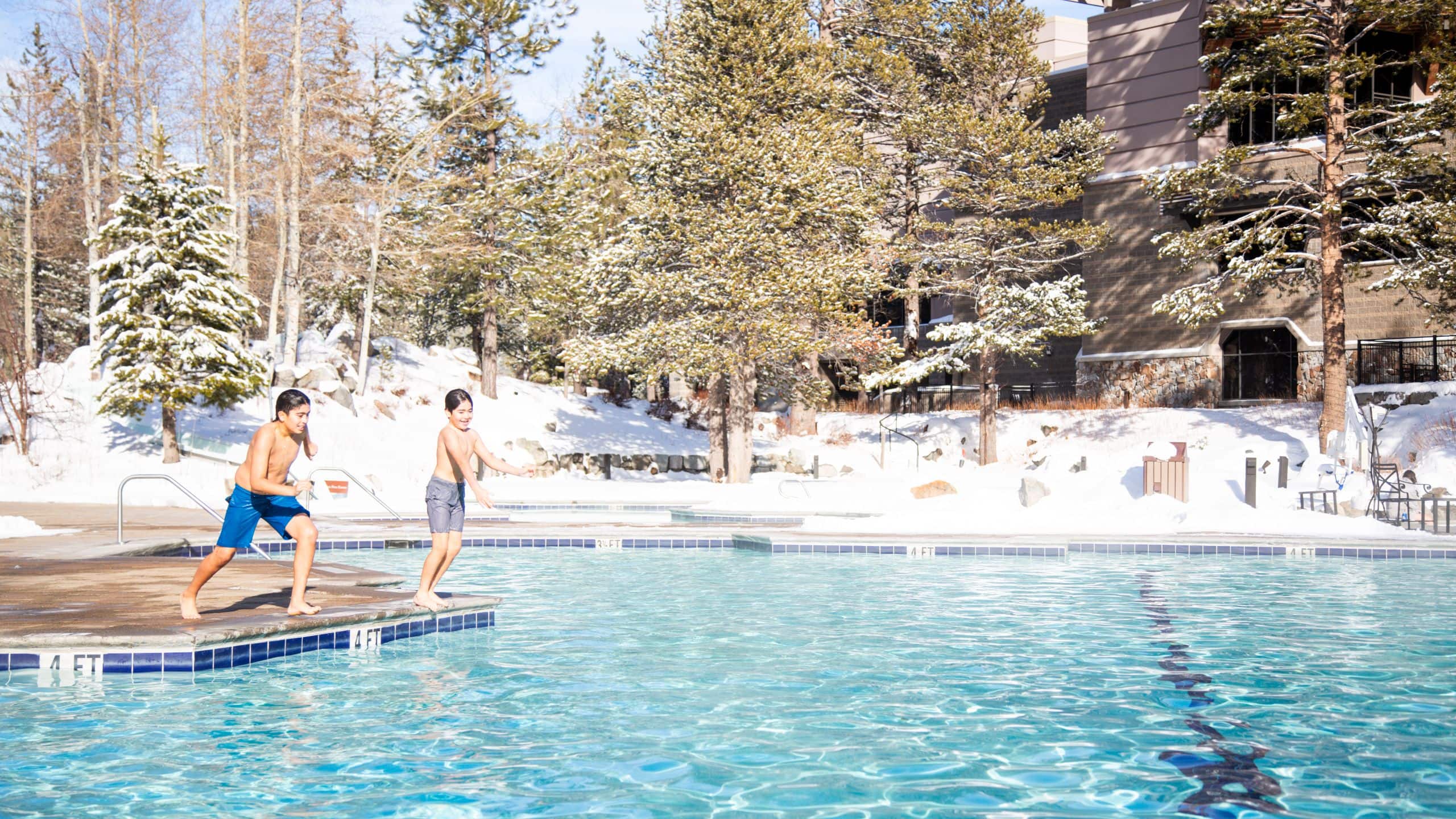 Everline Resort & Spa Kids Jumping In Snowy Pool