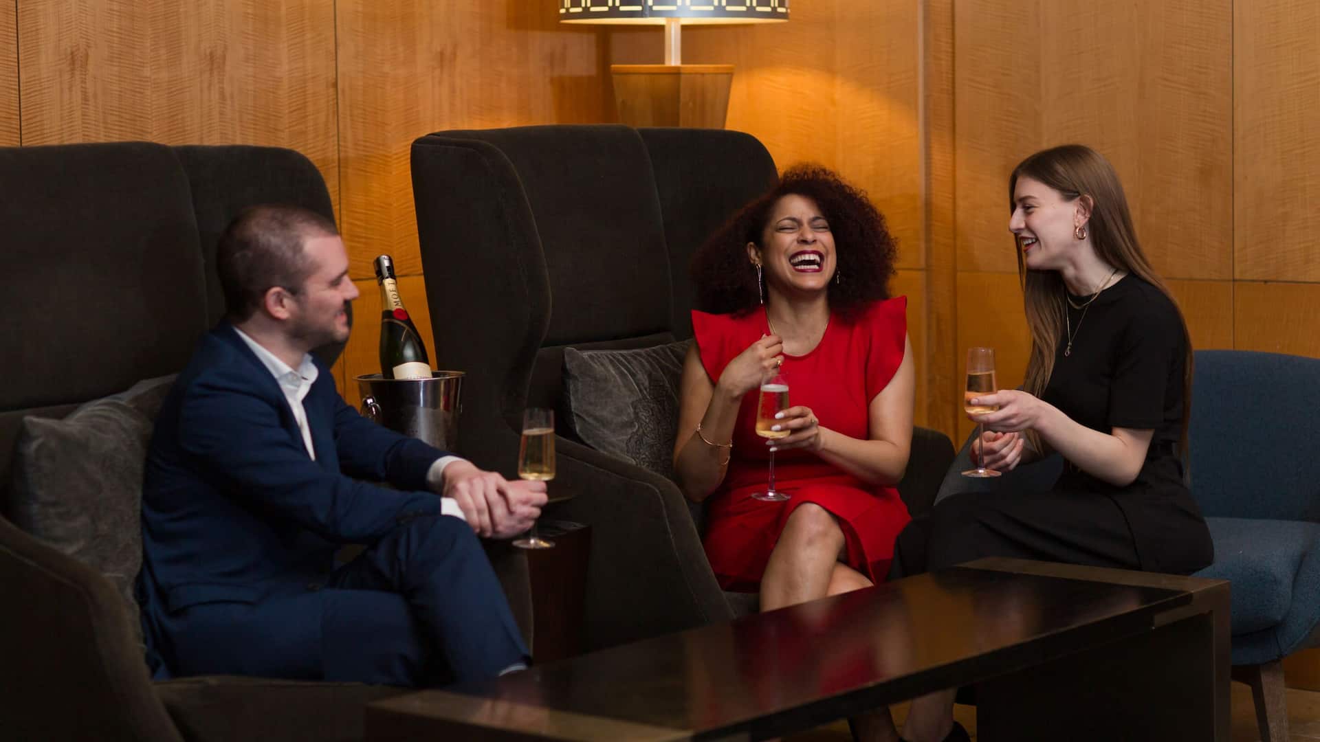 Grand Hyatt Seattle Friends Laughing With Cocktails