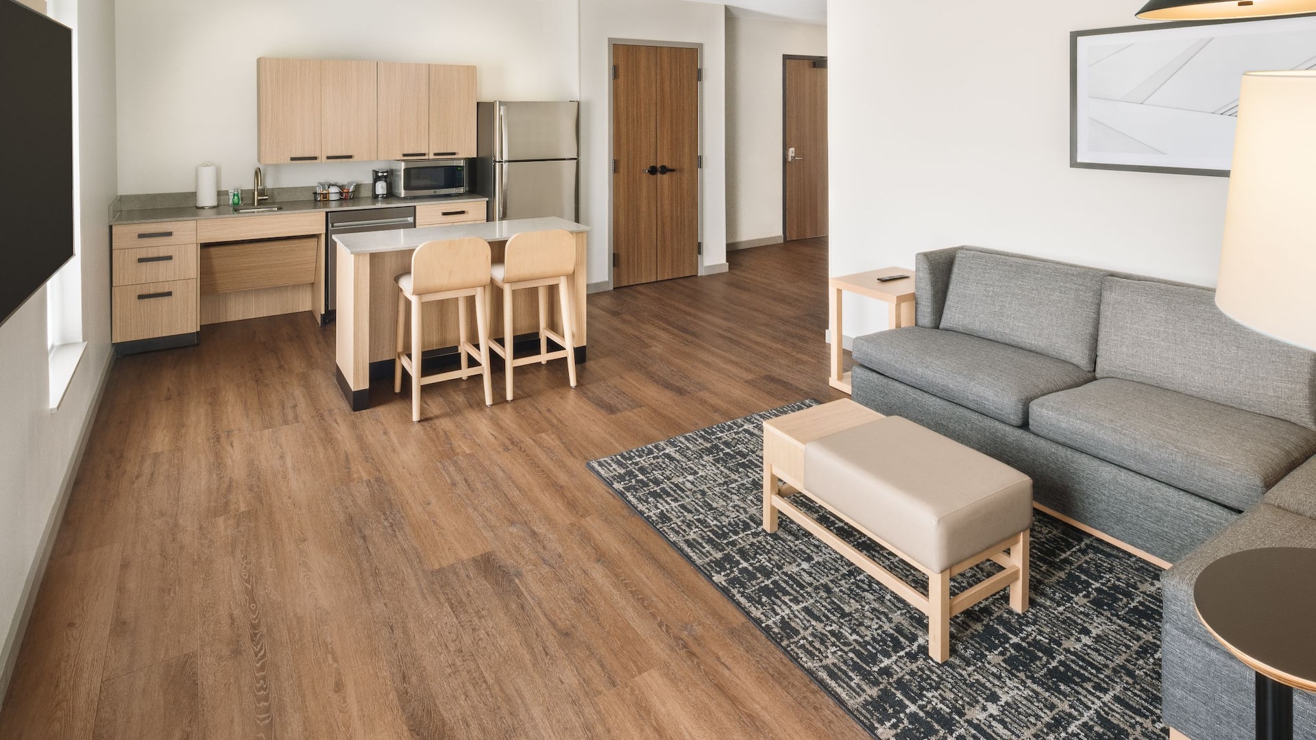 Hyatt Place Munster Guestroom Living Room And Kitchen With Island