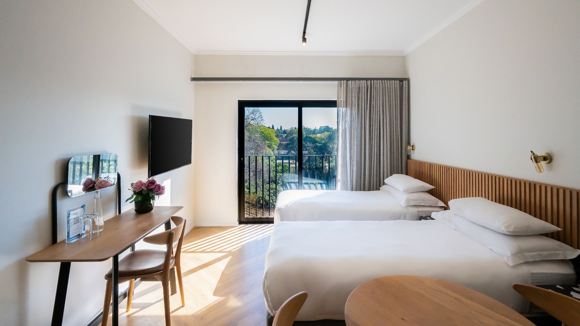  Apartment style room at Hyatt House Johannesburg Rosebank, with twin  beds, serene view, tv, vanity desk.