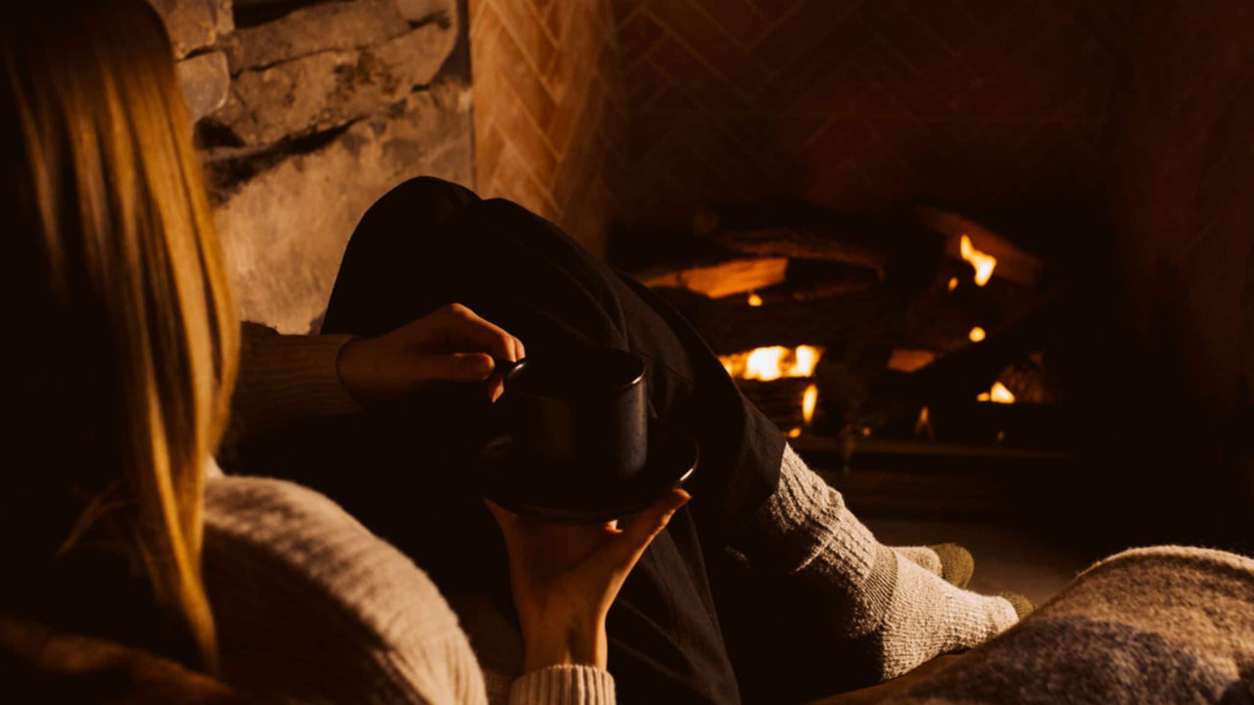 The Chatwal Lodge Woman Sitting Fireplace Coffee