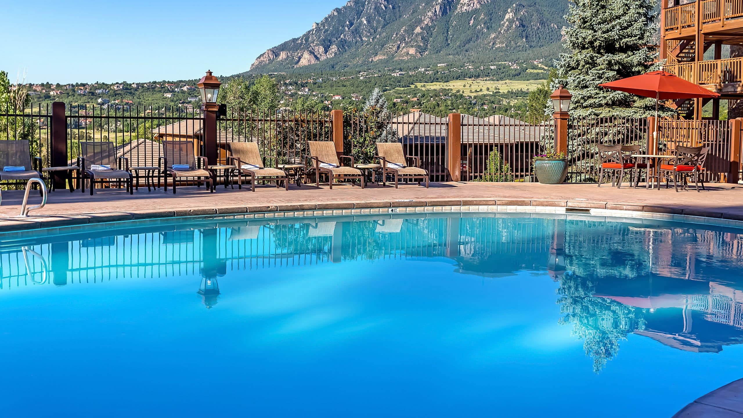 Cheyenne Mountain Resort Pool And Lounge Chairs With Mountain Backdrop