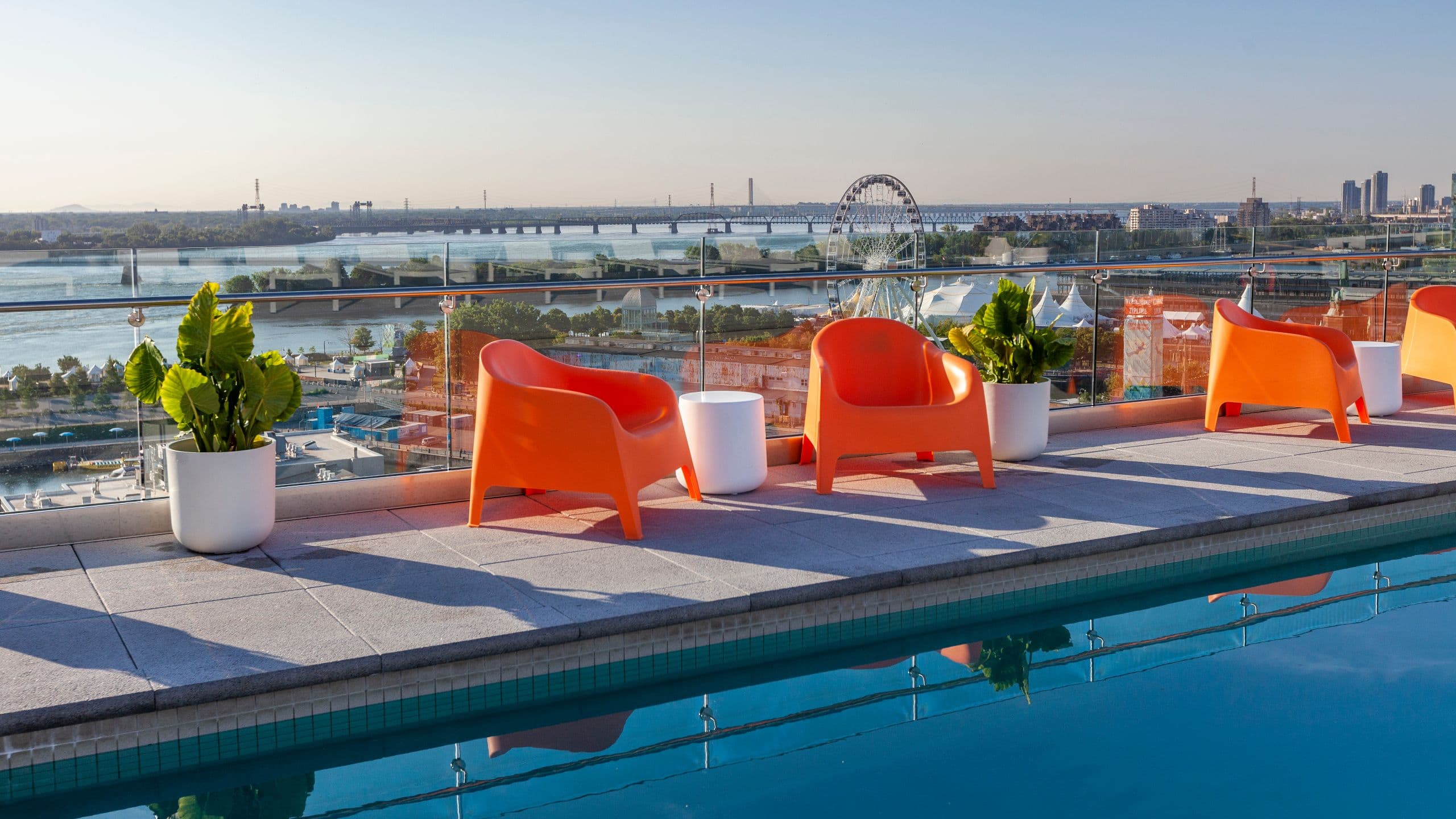 Hyatt Centric Montreal Swimming Pool Orange Chairs