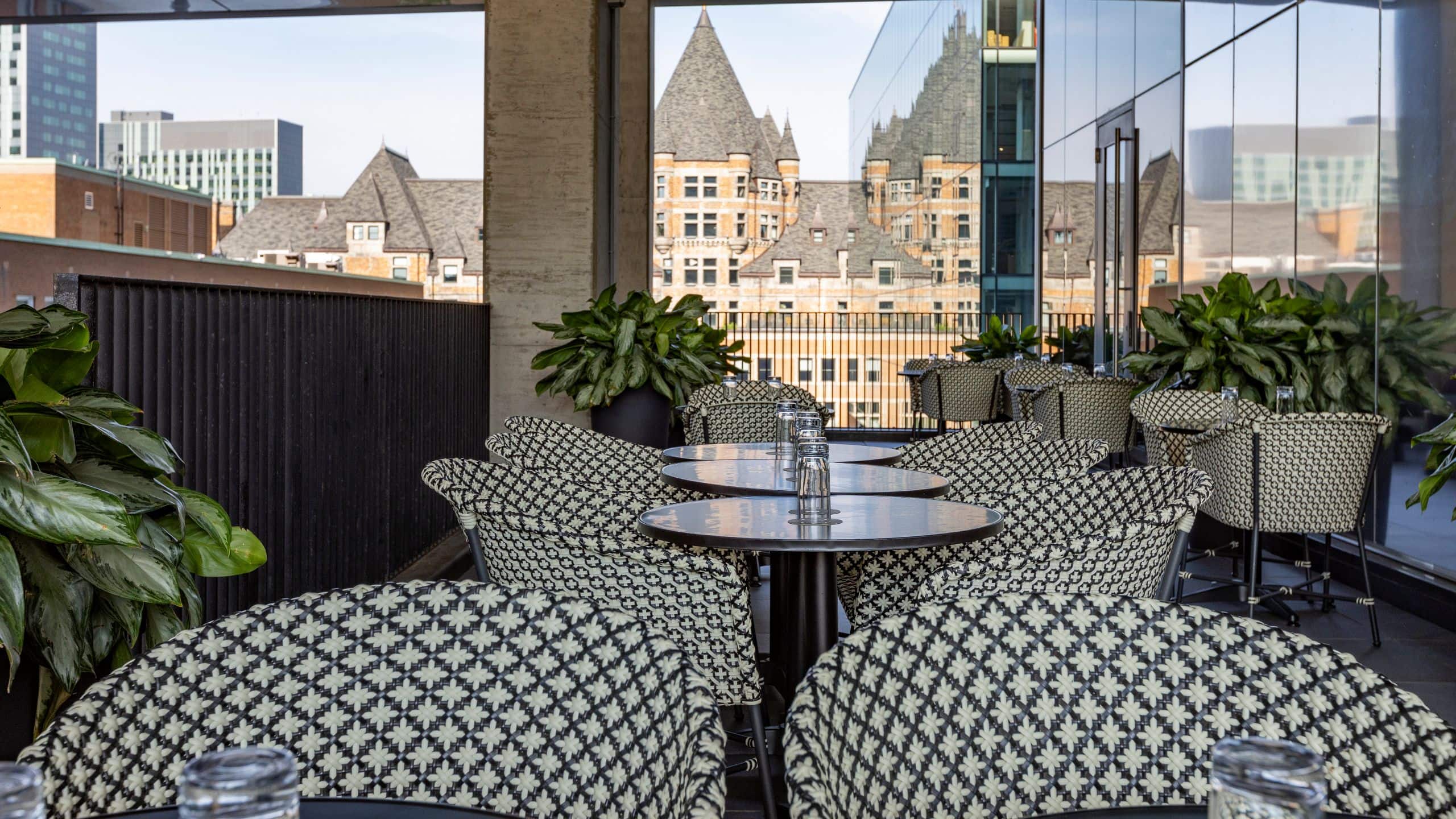 9 of 9 Hyatt Centric Montreal Pub Cartier Arms Terrace Castle Backdrop