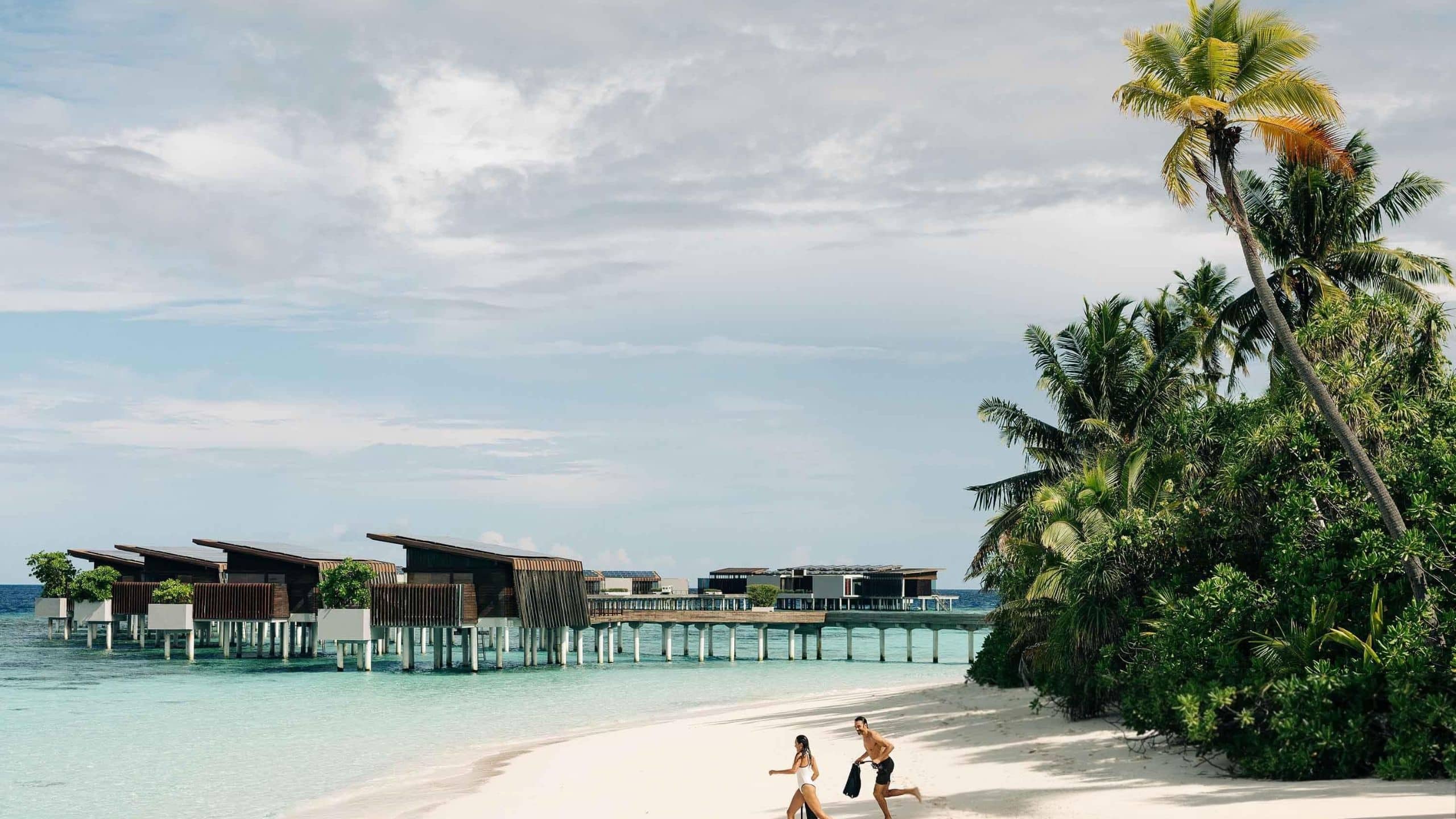 Park Hyatt Maldives Hadahaa Couples Walking To The Ocean With Overwater Villa