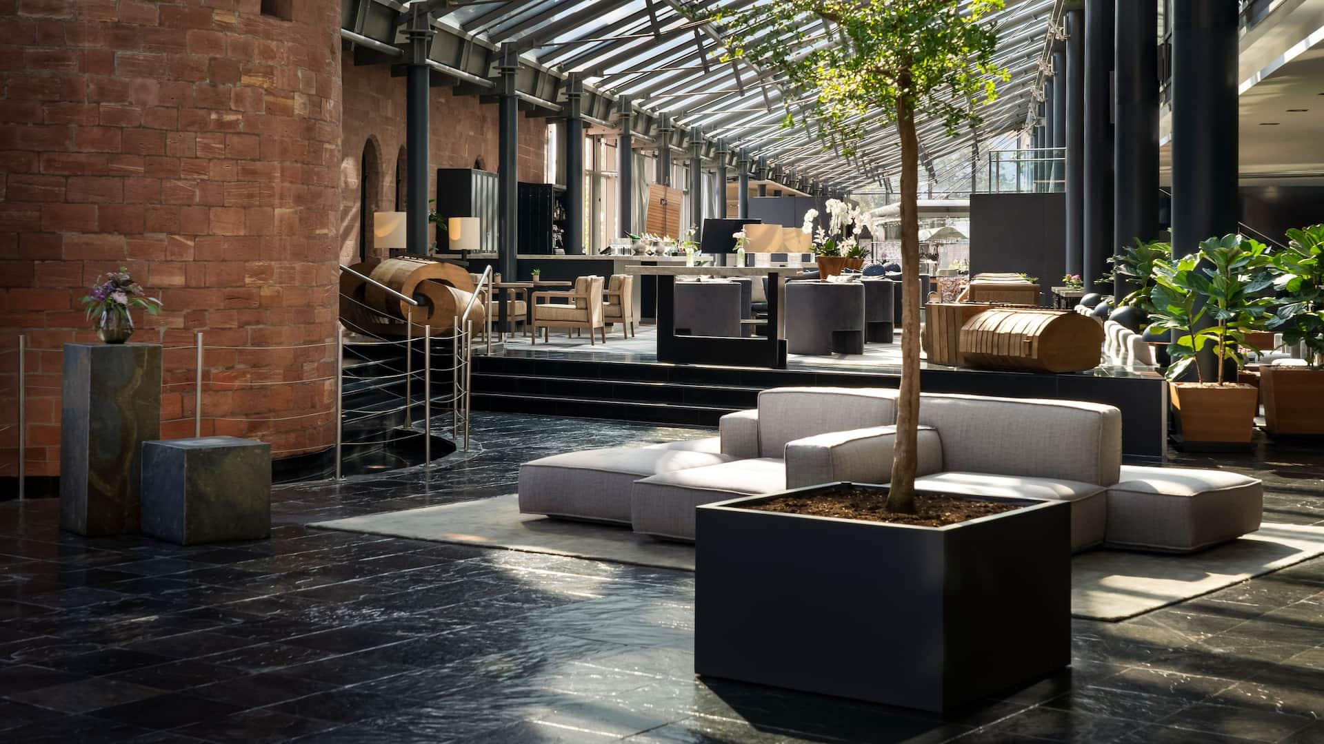 Comfortable and modern seating in the light filled lobby with a view of Fort Malakoff in Hyatt Regency Mainz