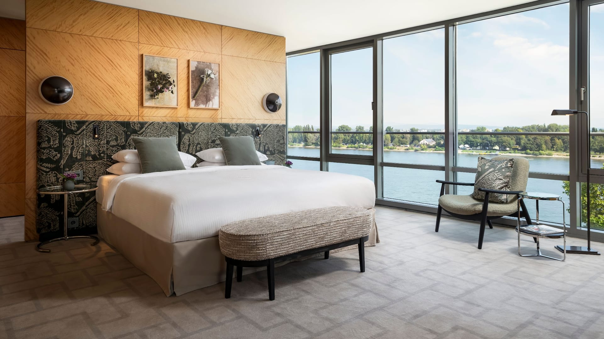 Elegant and modern Presidential Suite bedroom with panoramic windows with Rhine view at Hyatt Regency Mainz