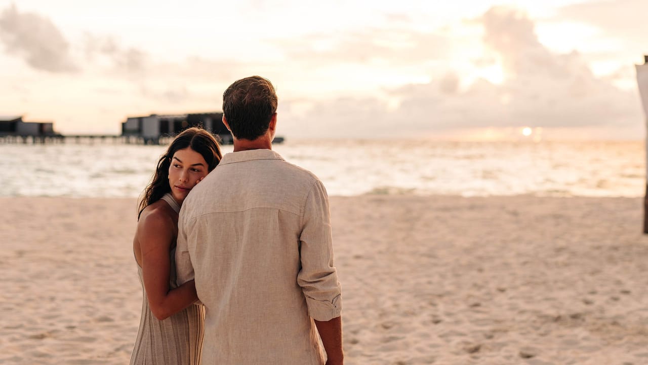 Maldives Honeymoon package couple holding hands