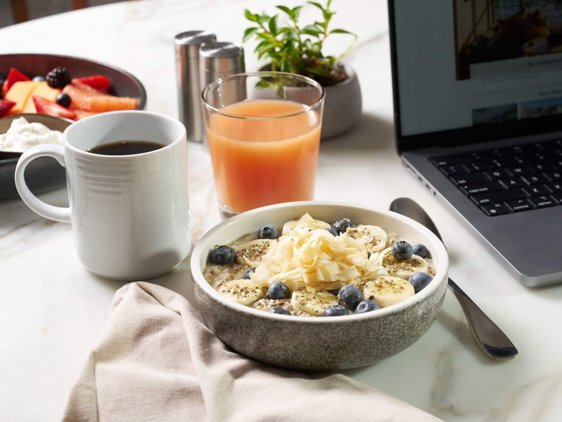 Hyatt Regency HR_P0507 Breakfast Spread With Oatmeal And Laptop