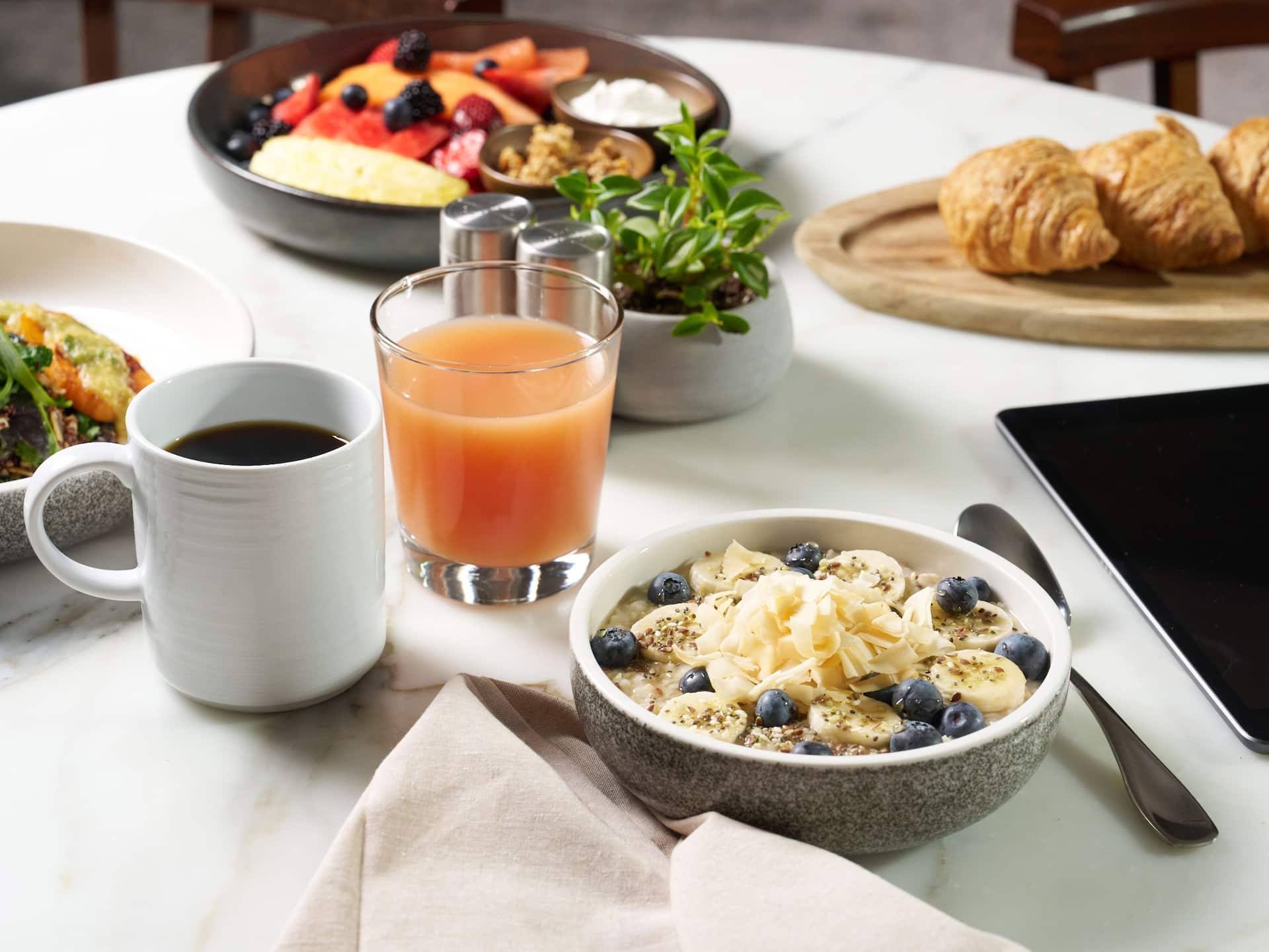 Hyatt Regency HR_P0508 Breakfast Spread With Oatmeal And Laptop
