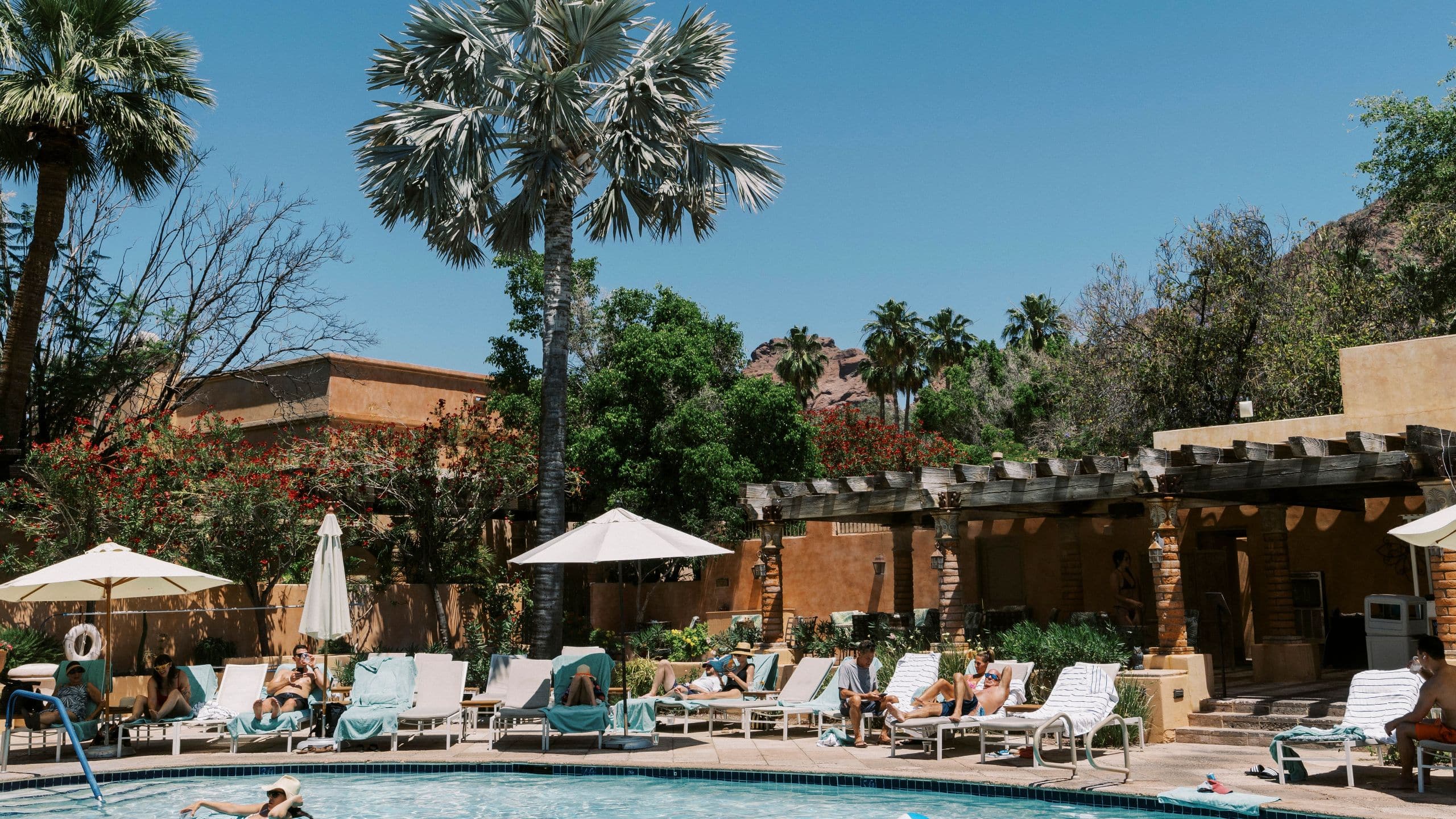 Royal Palms Resort and Spa Guests Playing in Pool Area