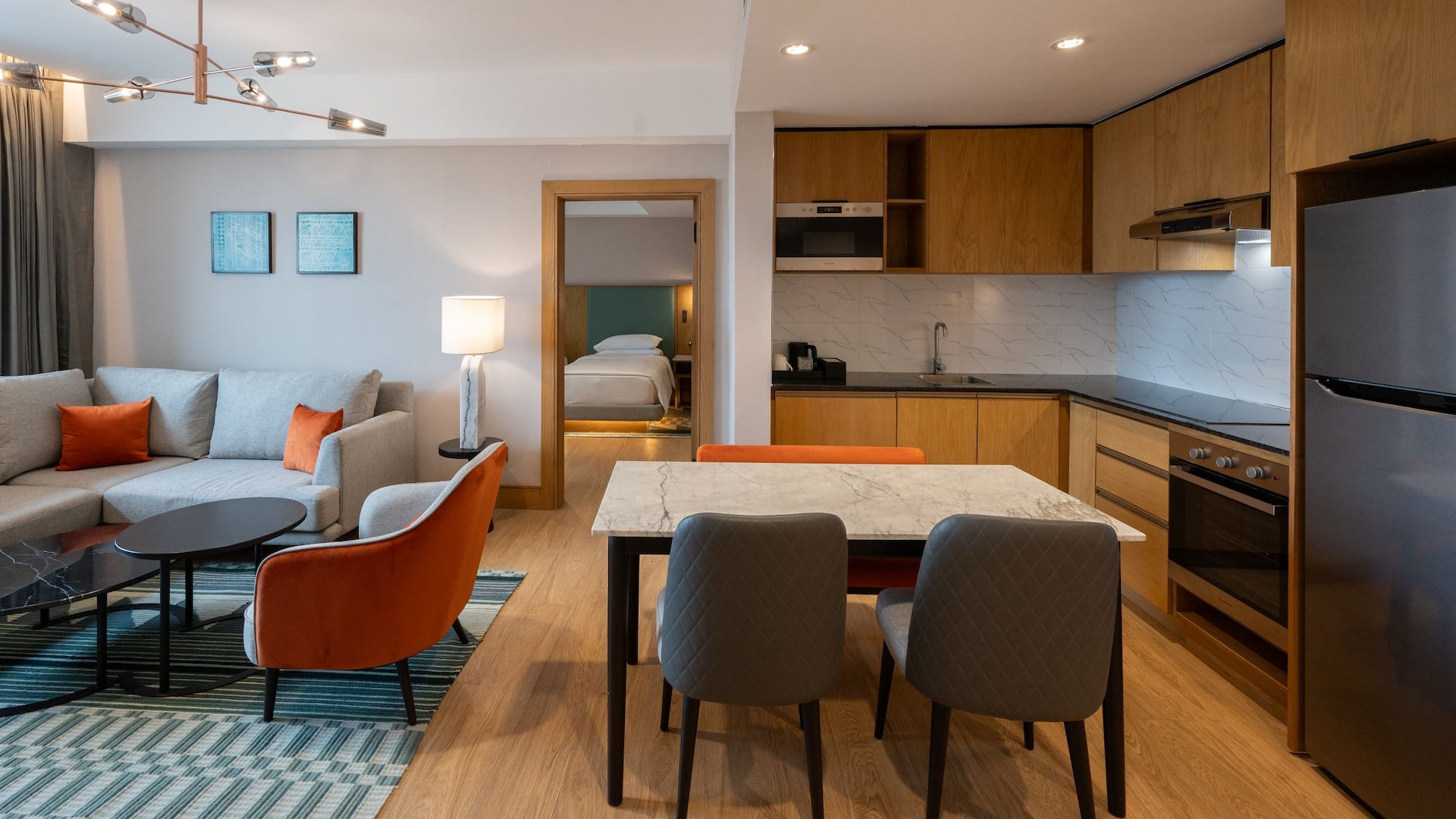 1/6 Two-bedroom apartment with an open-plan kitchen, dining and living area with modern décor suitable for long stays and family travel.
