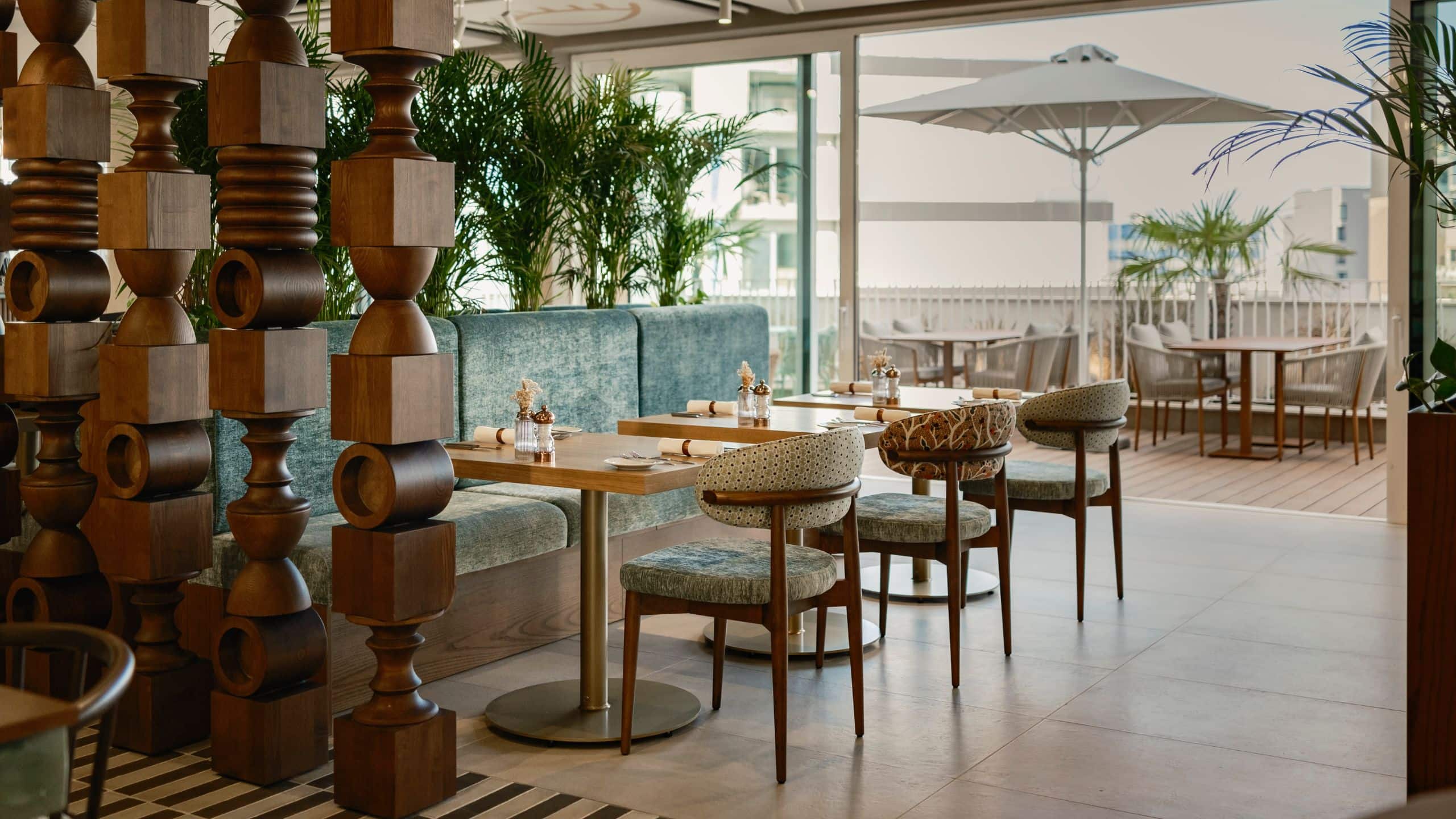 2 of 3 Hyatt Centric Malta Jumu Restaurant Tables With Open Patio