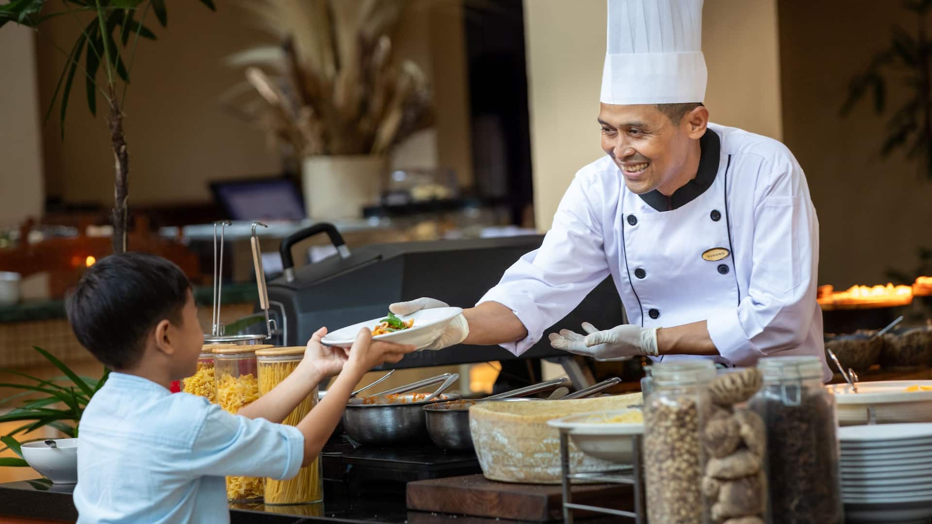 Hyatt Regency Yogyakarta Chef Giving Pasta To The Little Guest