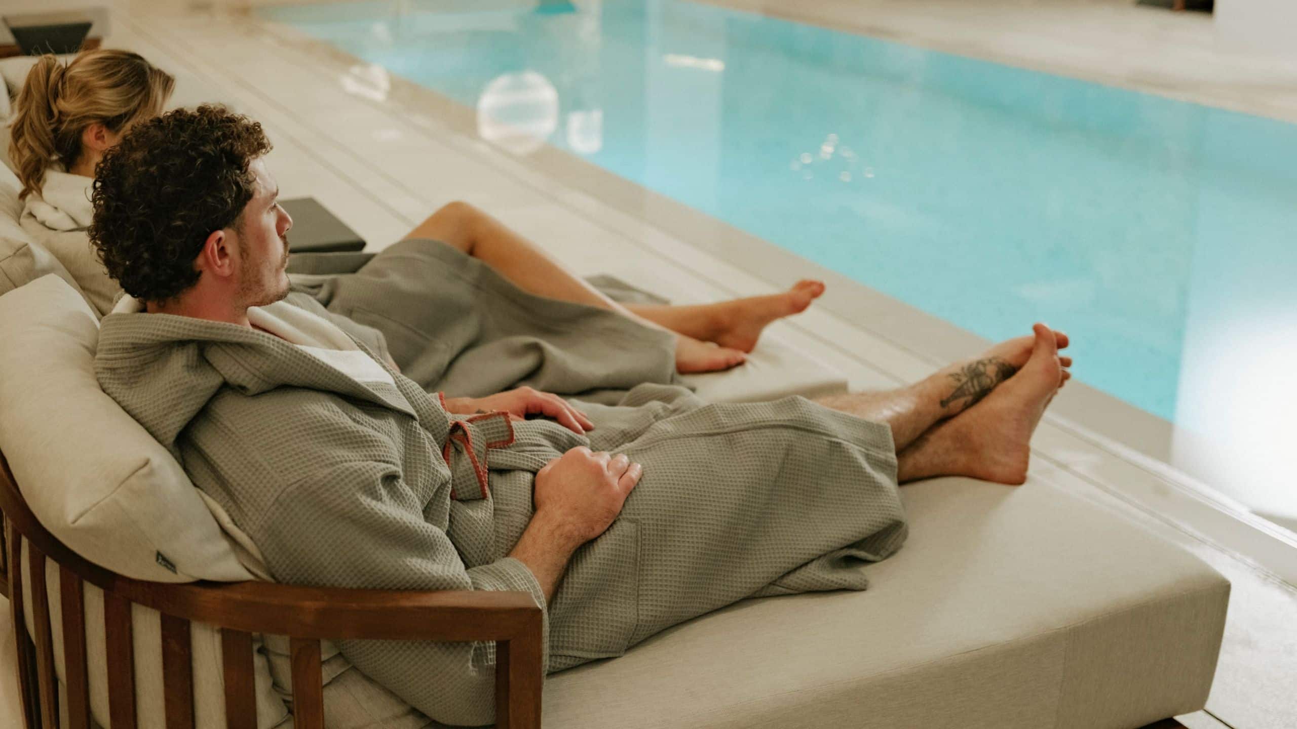 Hyatt Centric Malta Couple Relaxing By The Indoor Pool