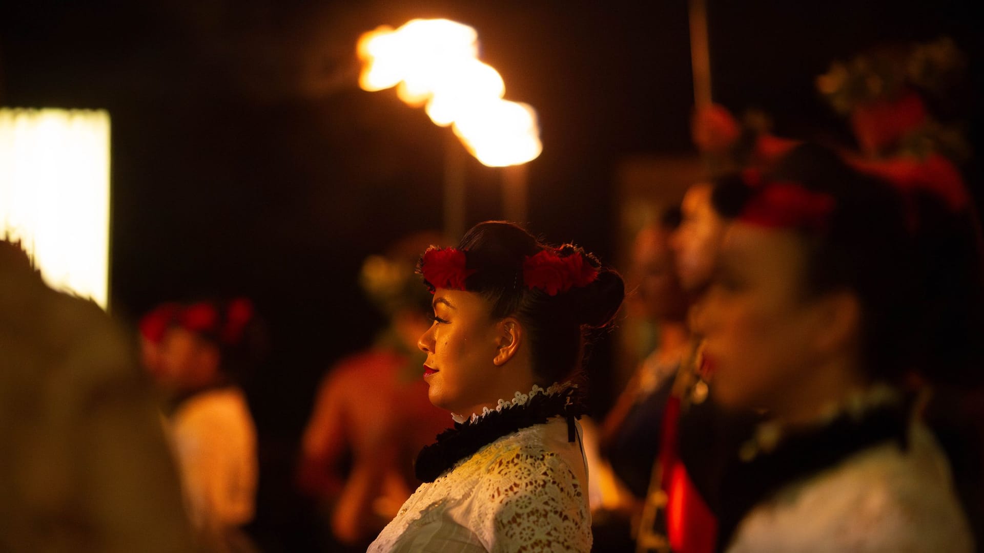 Hyatt Regency Waikiki Beach Resort and Spa Na Lei Aloha Luau Dancers Standing With Torch