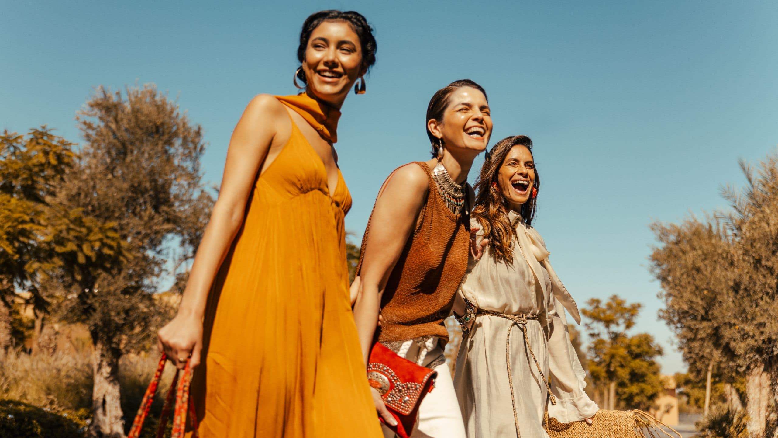 Park Hyatt Marrakech Arrival Three Women Smiling Blue Sky