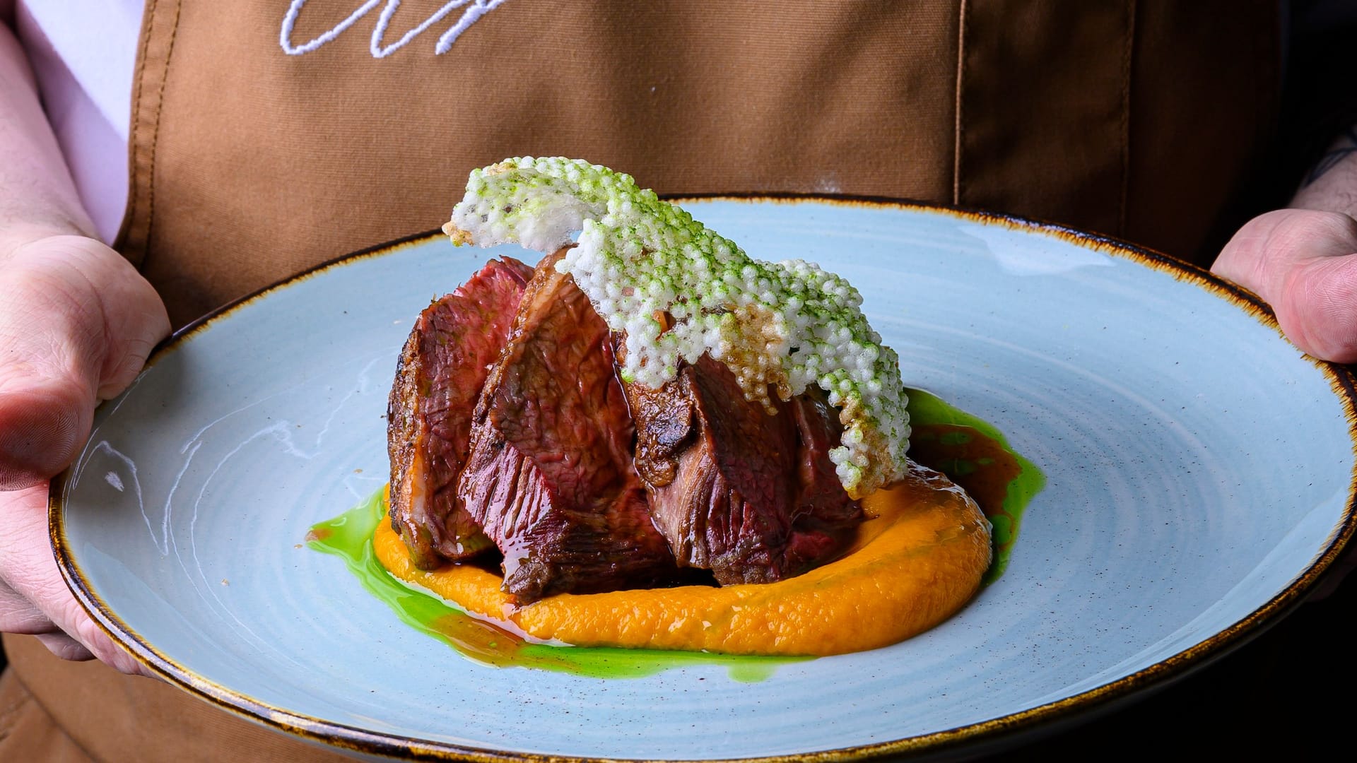 Hyatt Place Melbourne Caribbean Park Archies Farm Restaurant Bar Chef Holding Lamb