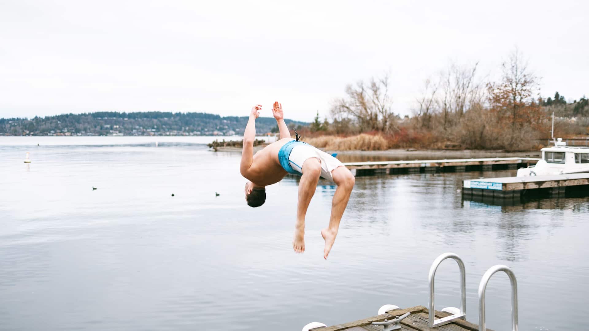 Hyatt Regency Lake Washington at Seattle's Southport Man Doing Backflip Off Dock