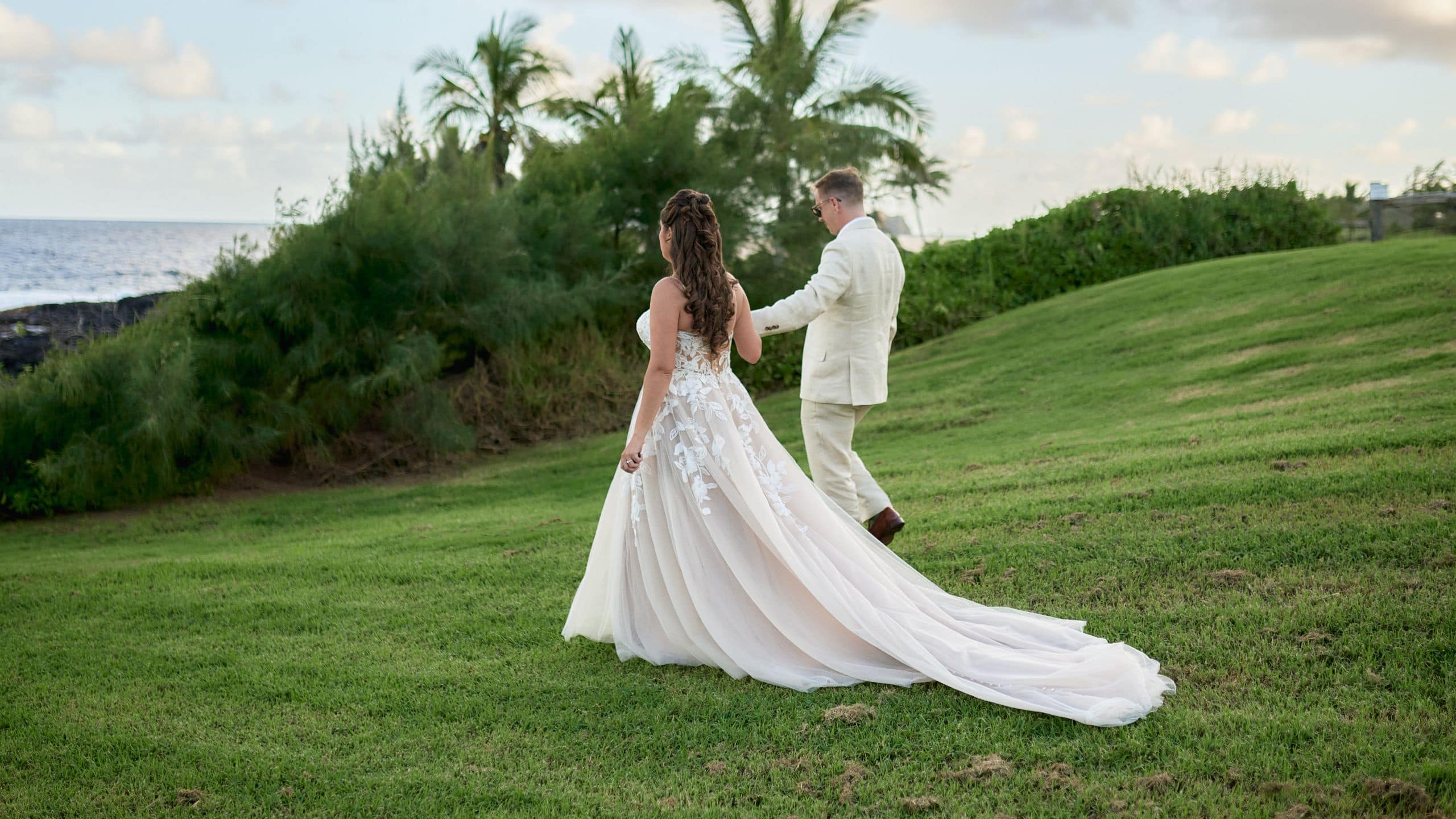 Hana-Maui Resort Bride and Groom Walking Hillside