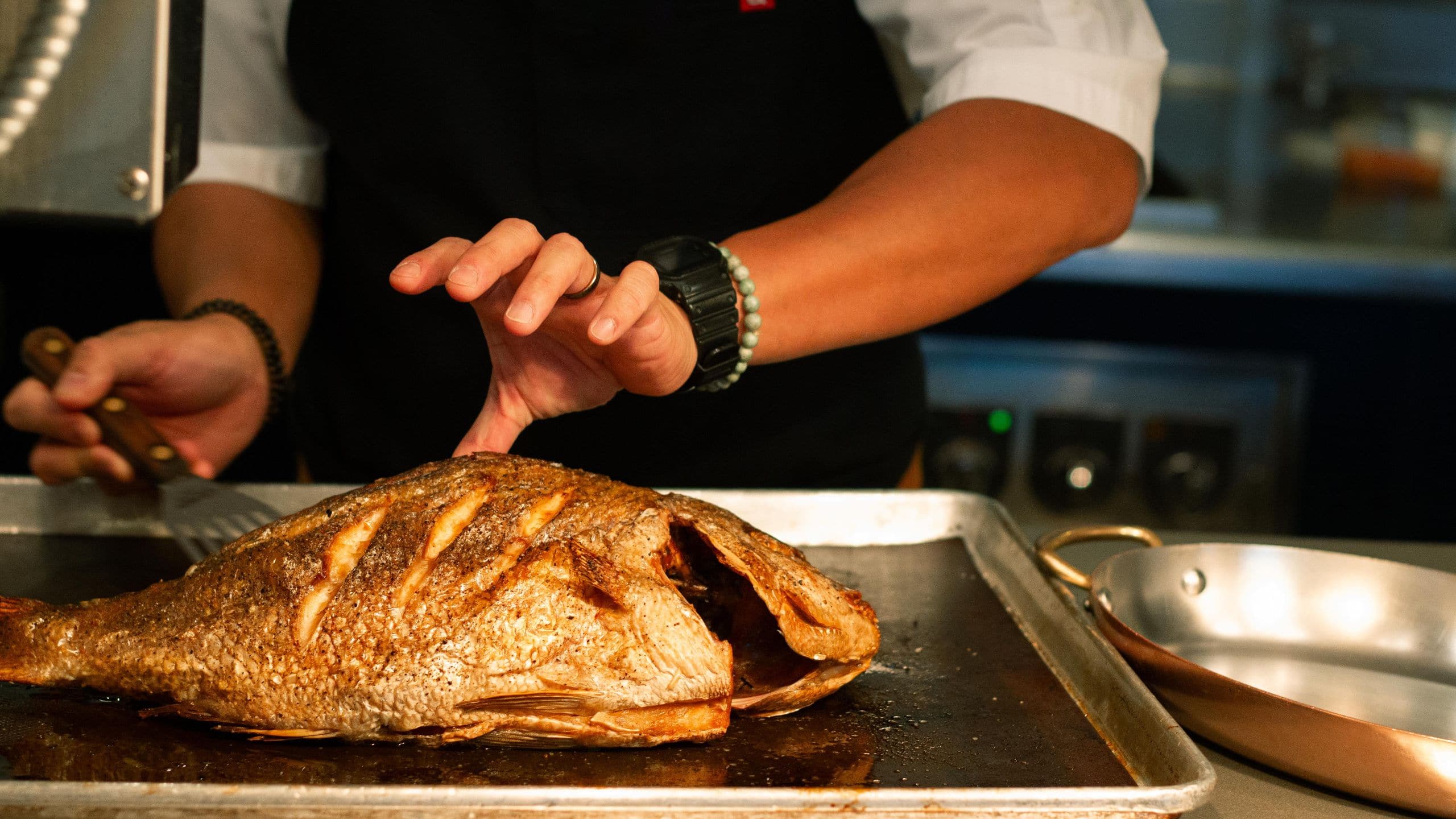 Park Hyatt Chicago Chef Preparing Japanese Snapper In Nomi Kitchen