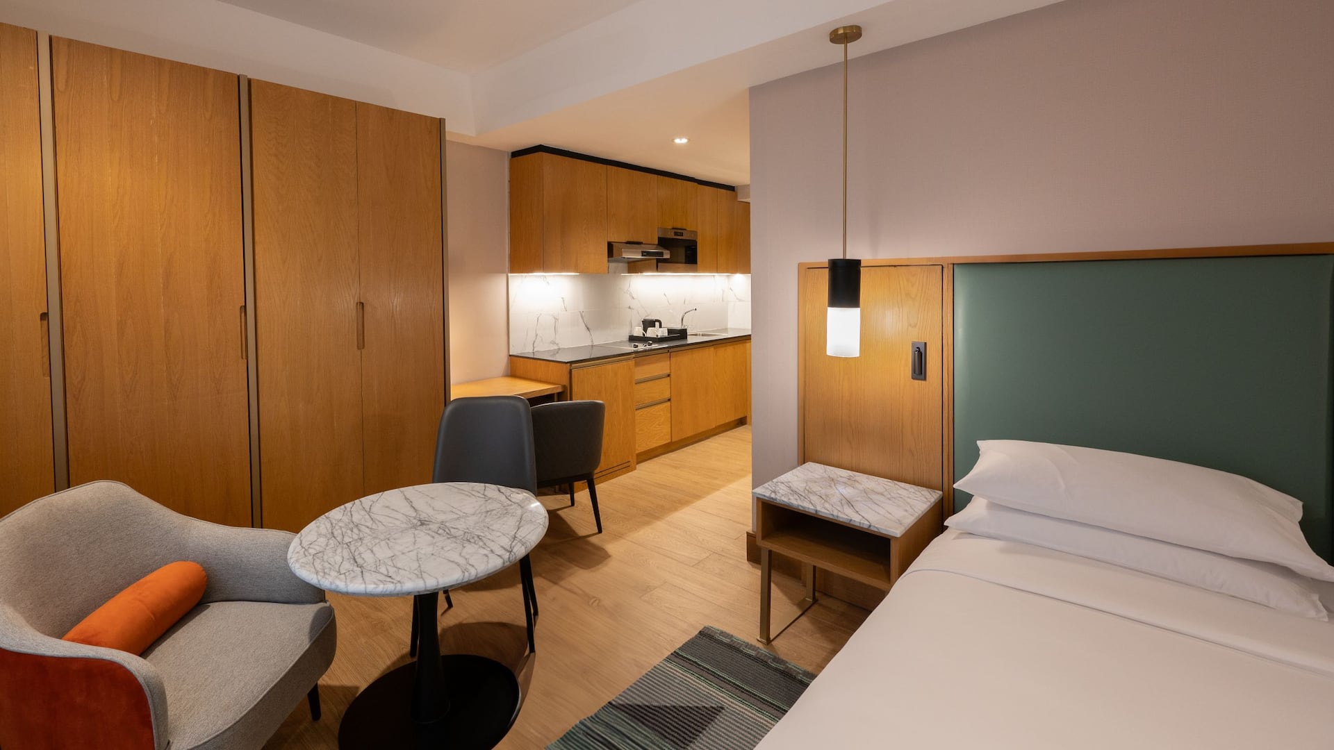 1/6 Cozy Studio Apartment in Nairobi with a kitchenette, lounge chair and panoramic views of Nairobi.