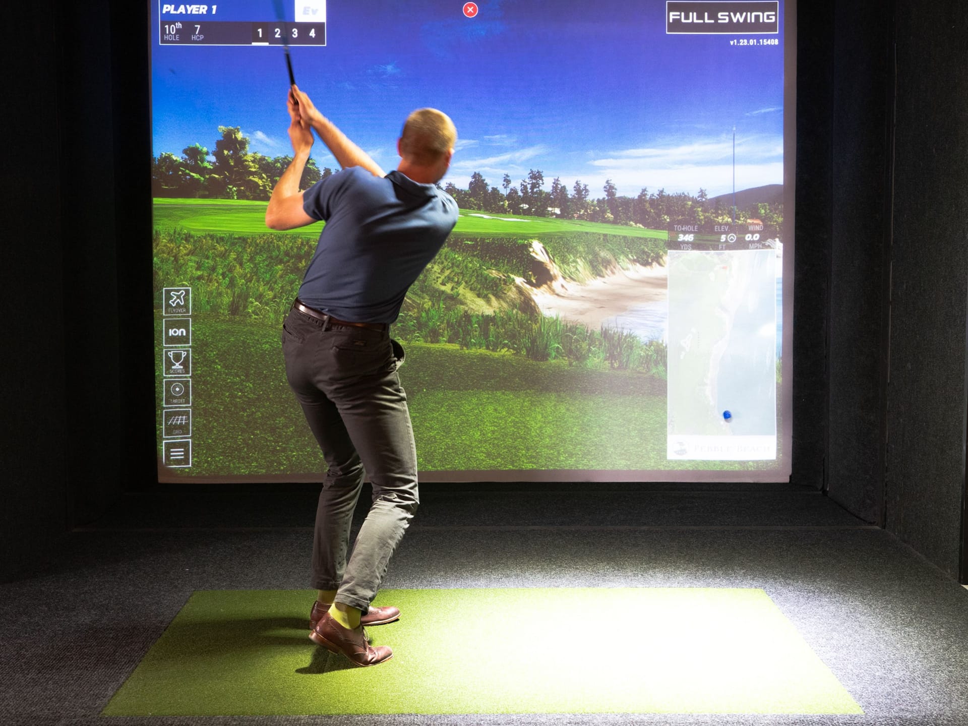Grand Hyatt Vail Top Golf Swing Suite Man Swinging Golf Club