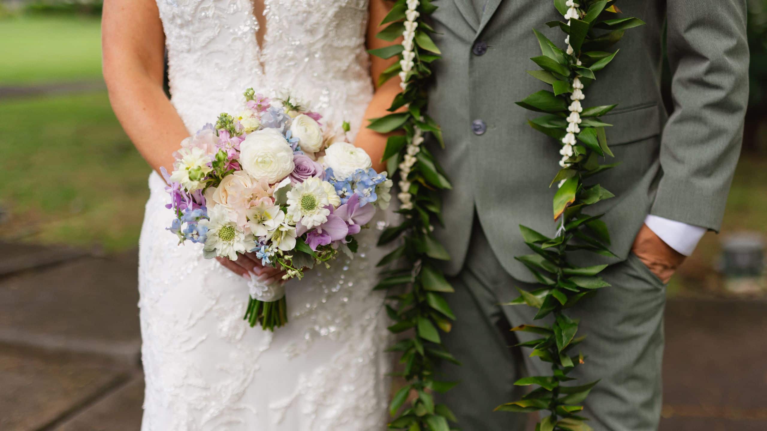 Hana-Maui Resort Wedding Couple With Leis and Bridal Bouquet