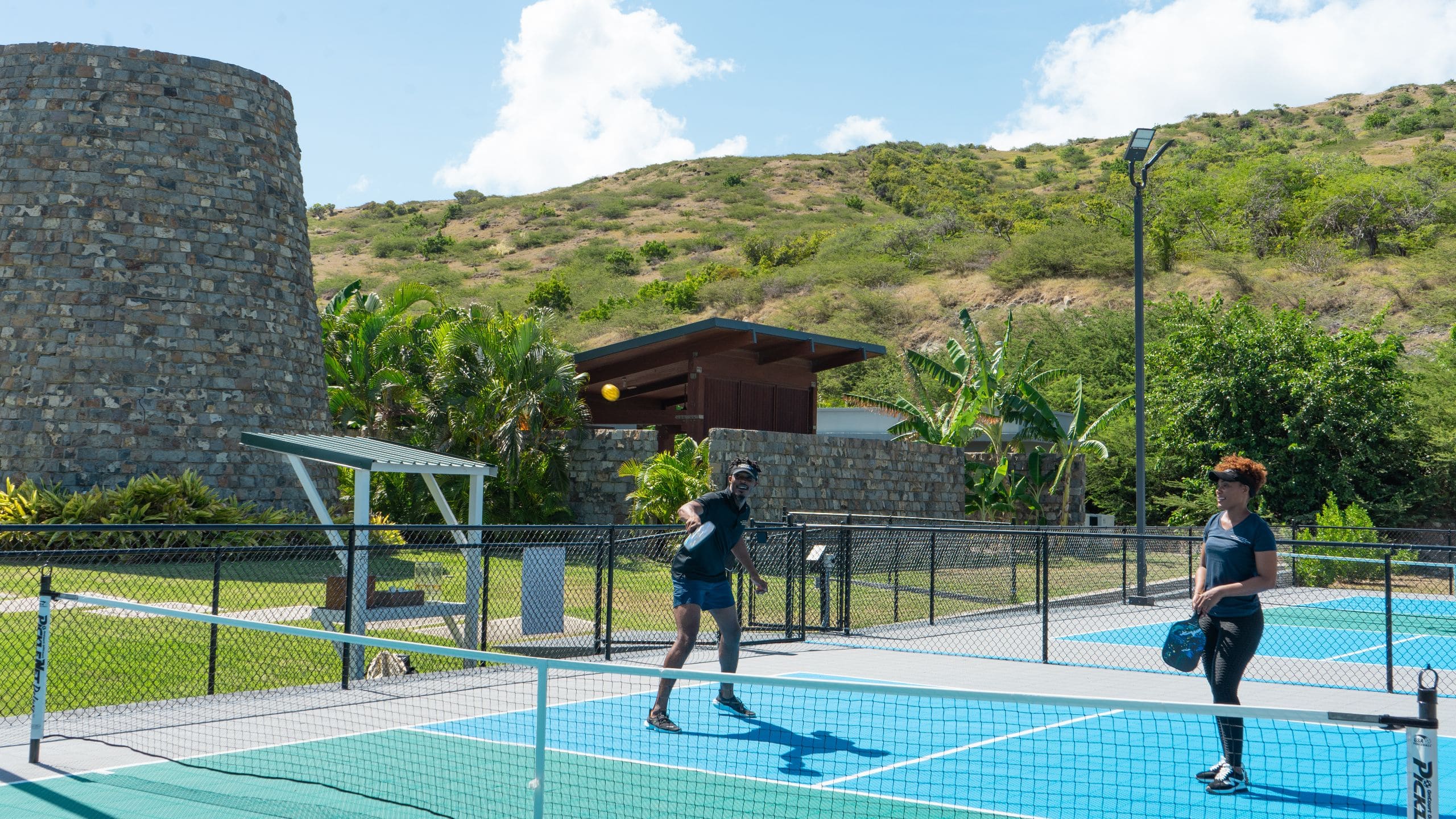 Park Hyatt St. Kitts Christophe Harbour Couple Playing Pickleball