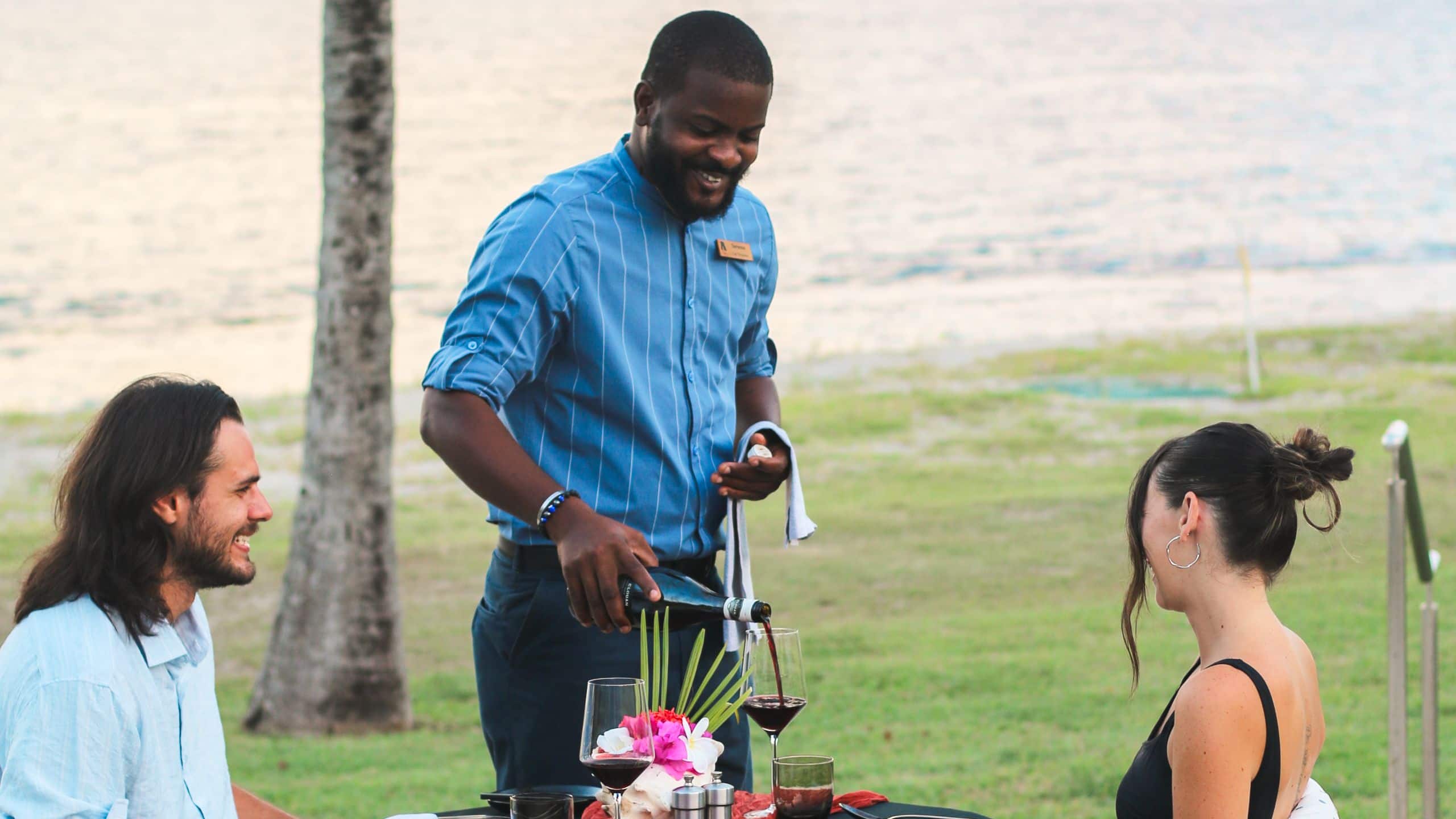 Park Hyatt St. Kitts Christophe Harbour Couple With Server Dining On Stone Barn Terrace