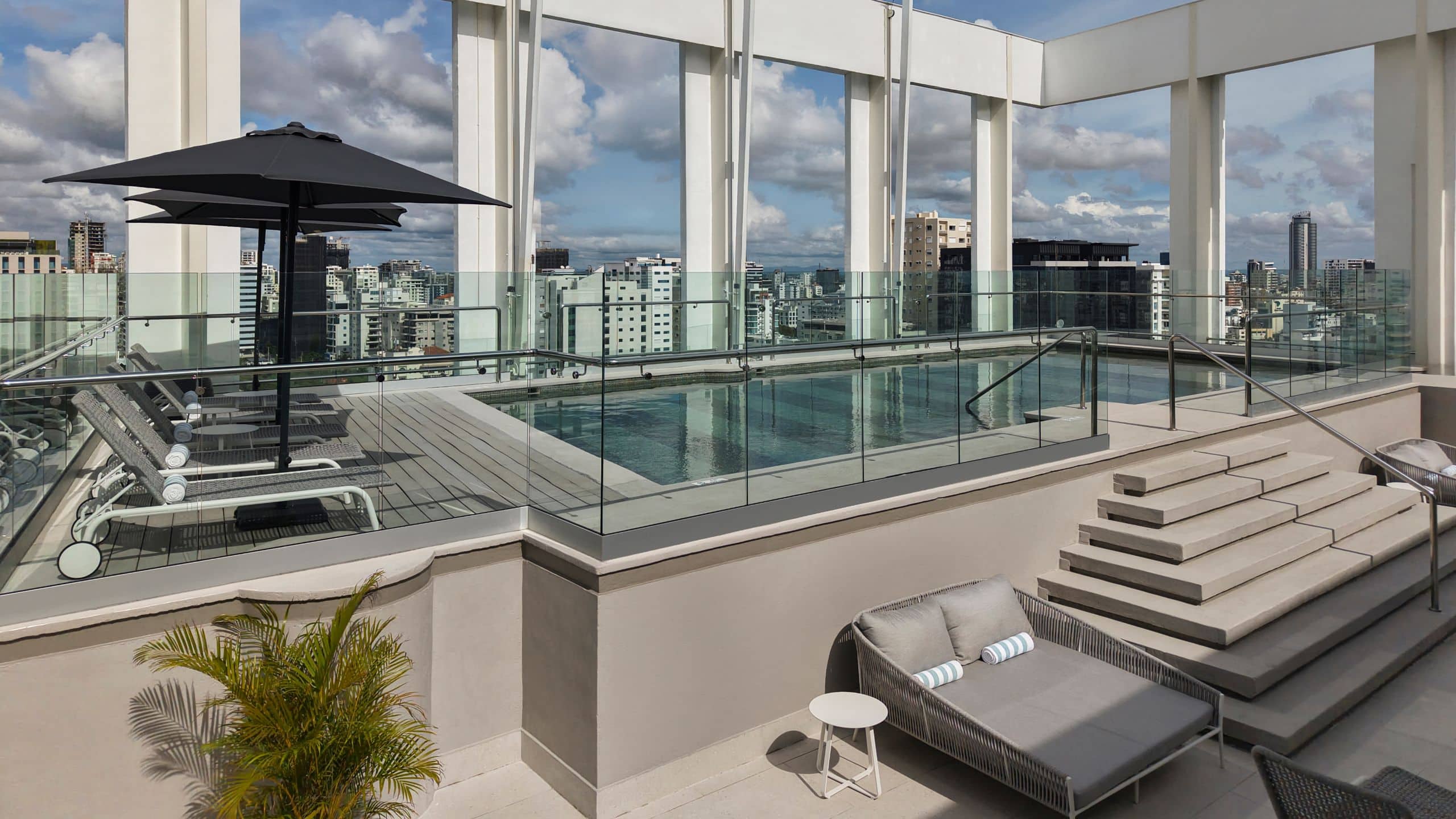 Hyatt Centric Santo Domingo Pool With Lounge Chairs And Umbrellas