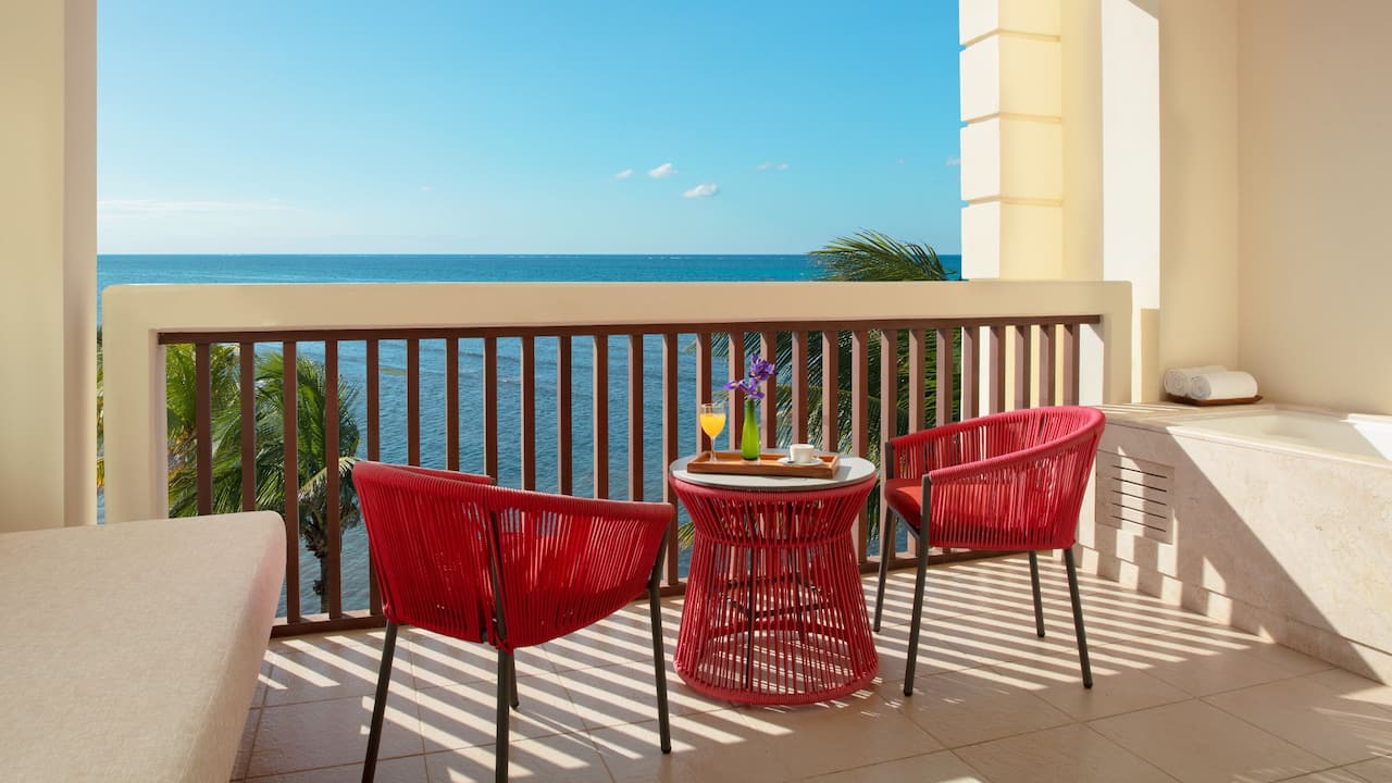 Master Suite Terrace with red chairs and table