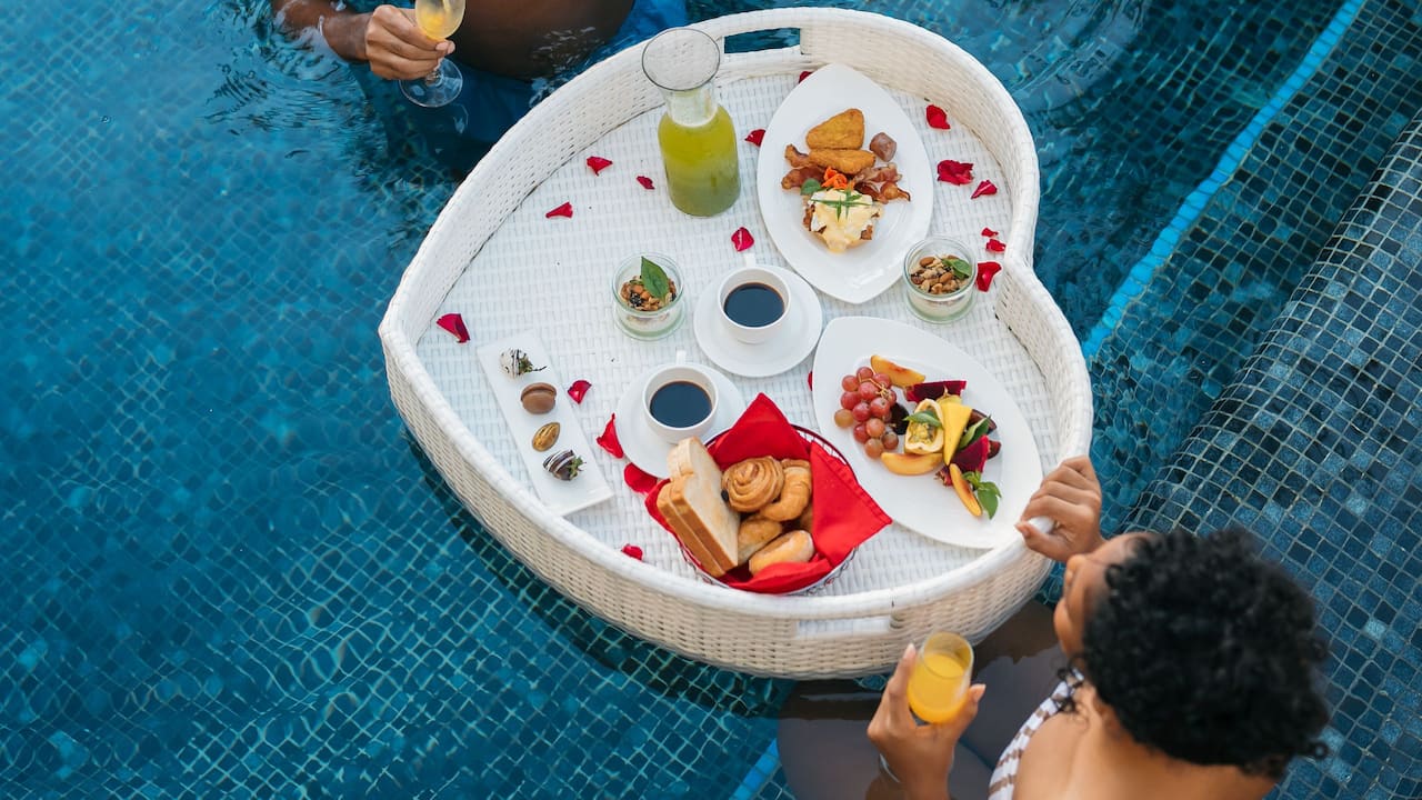 Couple Sharing Floating Breakfast