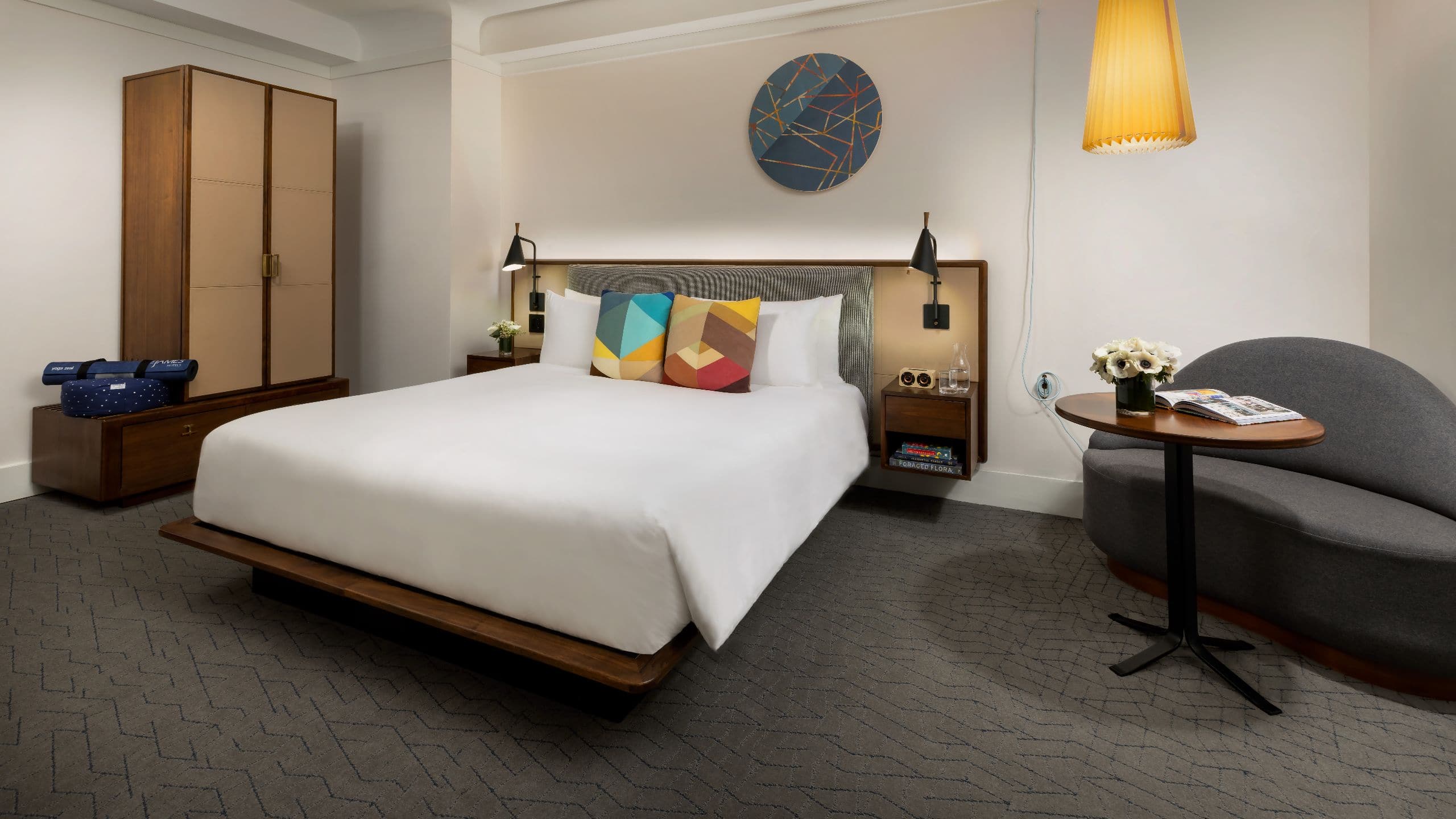 Hotel Seville NoMad King Deluxe Bedroom With Floral Arrangements
