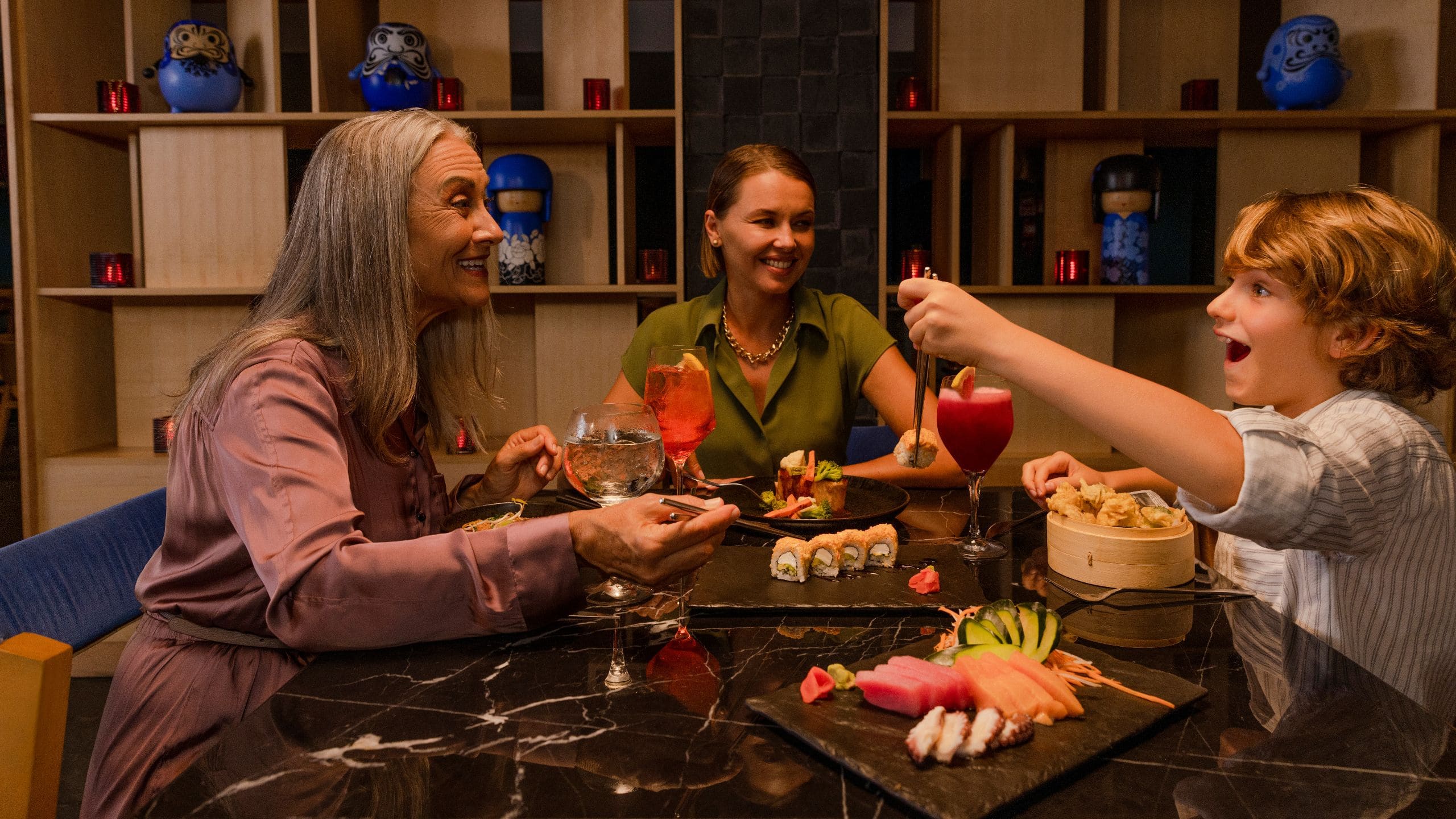 Dreams Puerto Morelos Resort & Spa Mulit-gen Family Eating Sushi