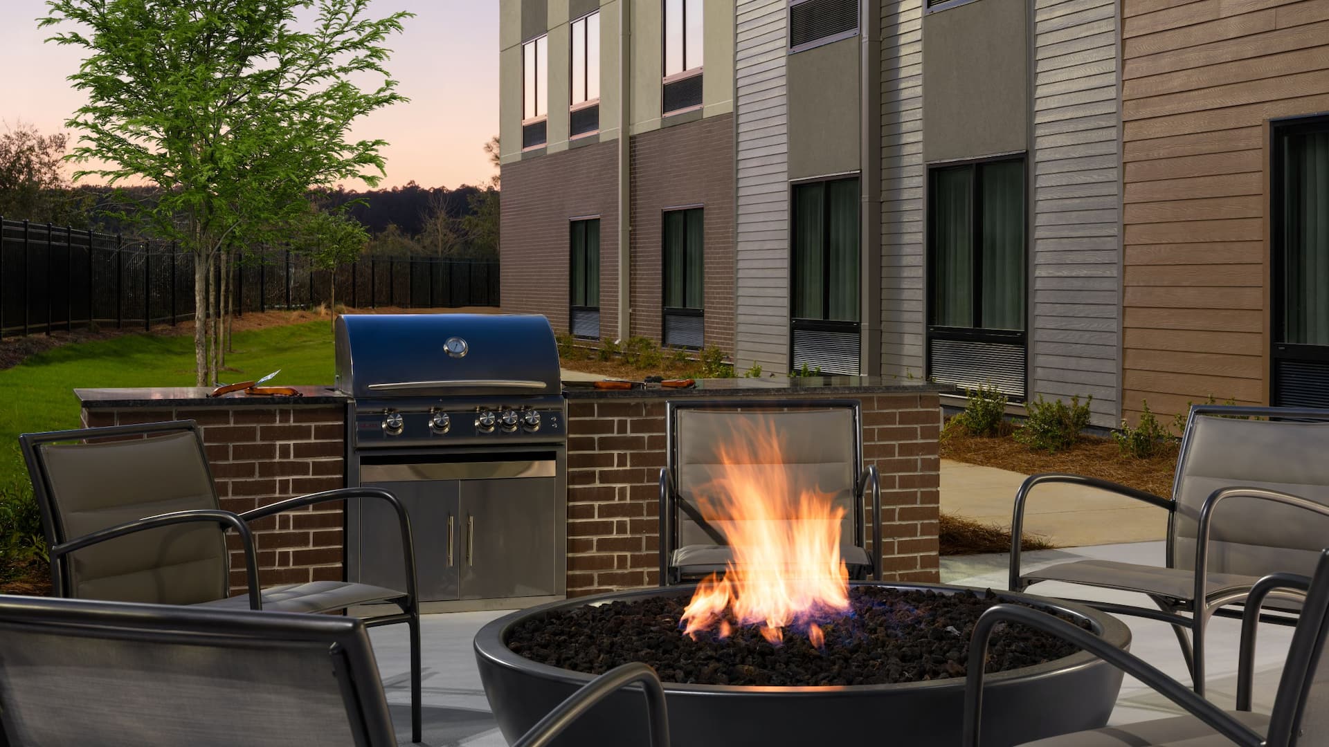 Hyatt Studios Mobile / Tillmans Corner Grill Area Dusk Firepit
